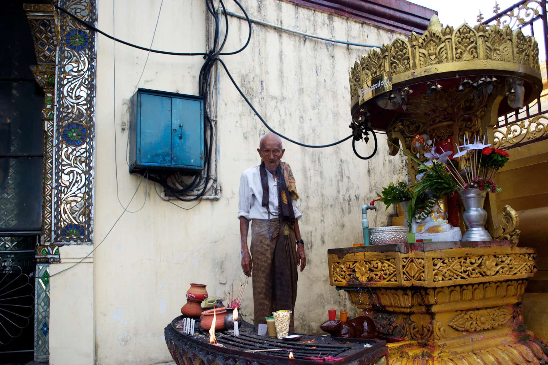 May 09, 2013 - Yangon, Myanmar: A devotee prays at Sule Pagoda in central Yangon. CREDIT: Paulo Nunes dos Santos