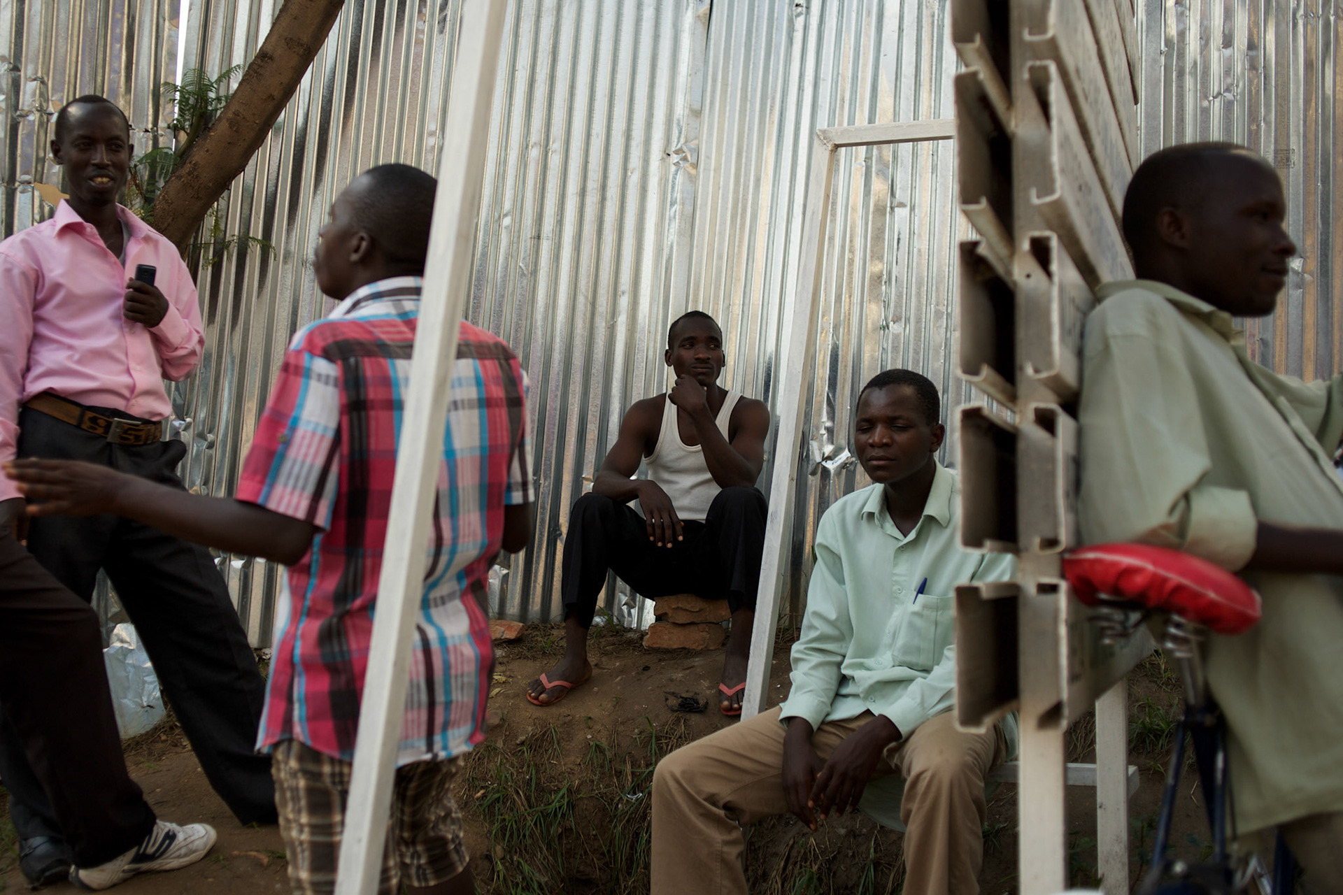 Burundian university students, seeking shelter outside the US embassy in Bujumbura, socialise near a vacant building close by. The students moved to the area in early May because, they claim, the US authorities ensure their security, after their university was closed amid anti-government protests. The government closed the university at the end of April, citing ìinsecurityî.
