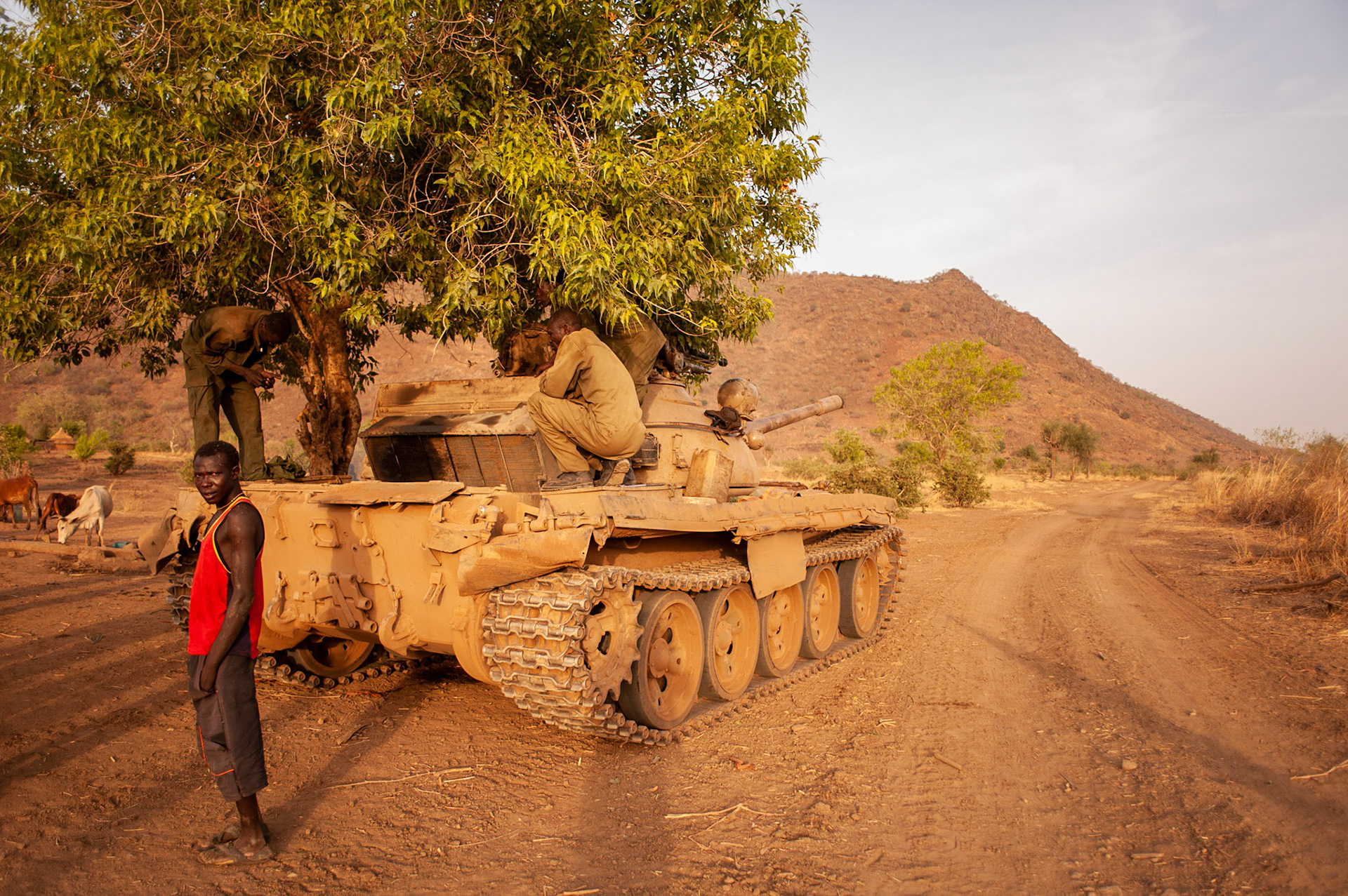 May 01, 2012 - Kauda, Nuba Mountains, South Kordofan, Sudan: Sudan People’s Liberation Movement (SPLA-N) rebel fighters fixe a war tank captured from Sudan's Armed Forces (SAF) during recent combats in the rebel-held territory of the Nuba Mountains in South Kordofan. SPLA-North, a historical ally of SPLA, South Sudan's former rebel forces, has since last June being fighting the Sudanese Army Forces (SAF) over the right to autonomy and of the end of persecution of Nuba people by the regime of President Bashir.
