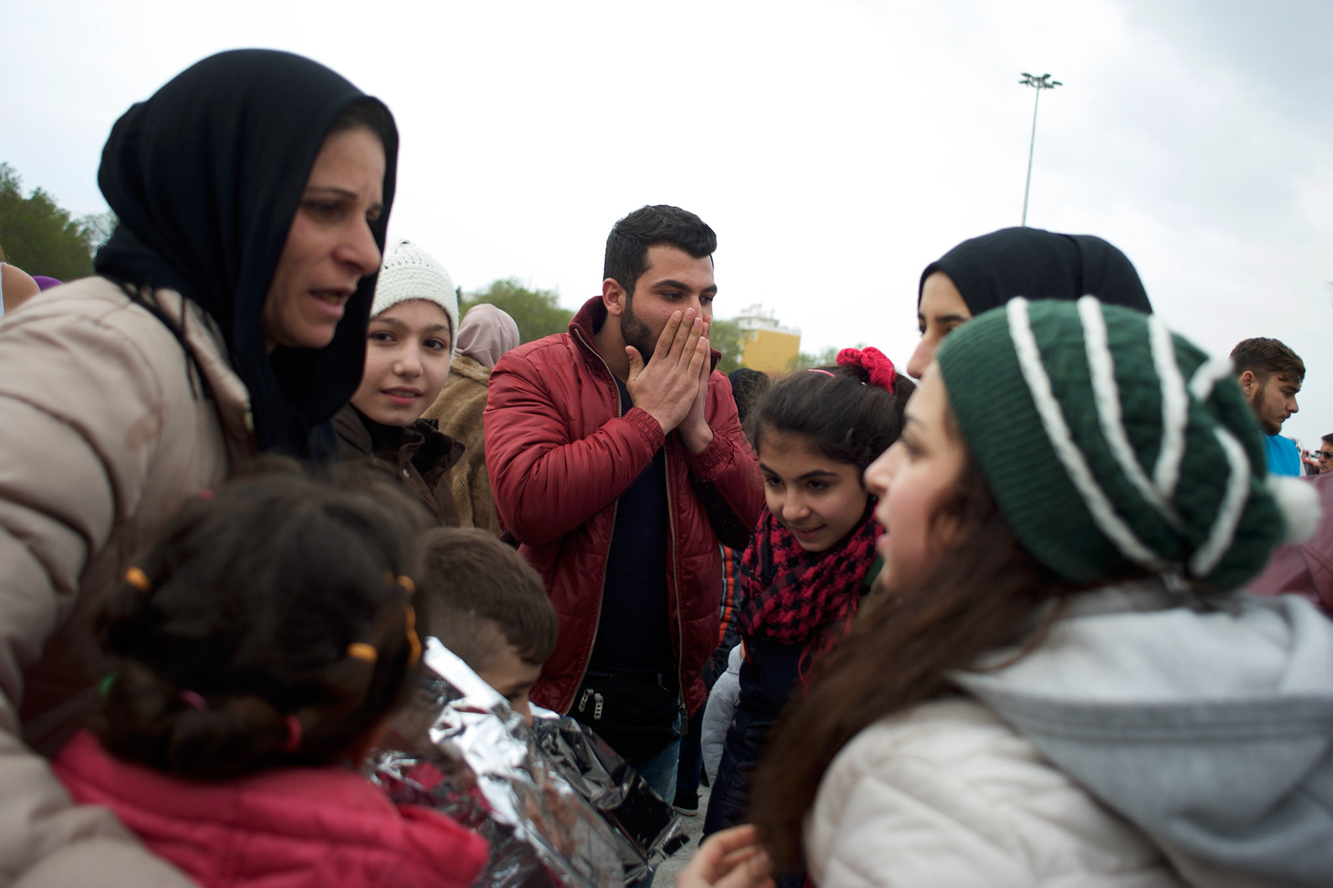 Omar Sidou and his mother Deniz, celebrate the arrival of his siblings at Mytilene port in Lesbos. Omar and his mother got separated from the rest of their family during a rescue operation in Turkish water two weeks before.