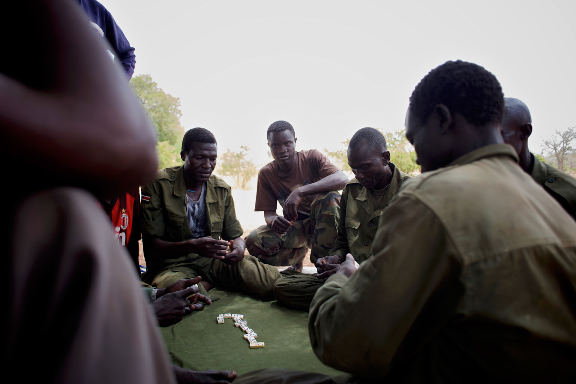 A group of Sudan People's Liberation Movement (SPLA-N) rebel fighters relax outside Jebel Kwo military base near Tess village in the rebel-held territory of the Nuba Mountains in South Kordofan.