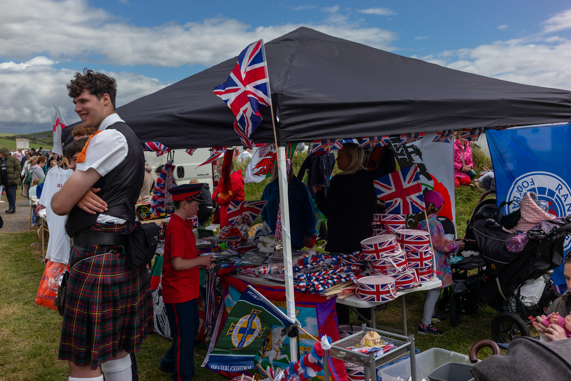A stall selling Union Jack and other unionist paraphernalia can be seen set on the side of a road during the annual Orange Order parade at Rossnowlagh Beach in Co. Donegal, Ireland, on July 06, 2024. Around 50 Orange lodges from Ireland and across Northern Ireland paraded down a country lane towards the seaside village of Rossnowlagh on Saturday, the only annual Orange Order parade in the Republic of Ireland. Thousands of people have attended the annual Orange Order parade which traditionally takes place on the Saturday before the main Twelfth demonstrations in Northern Ireland.