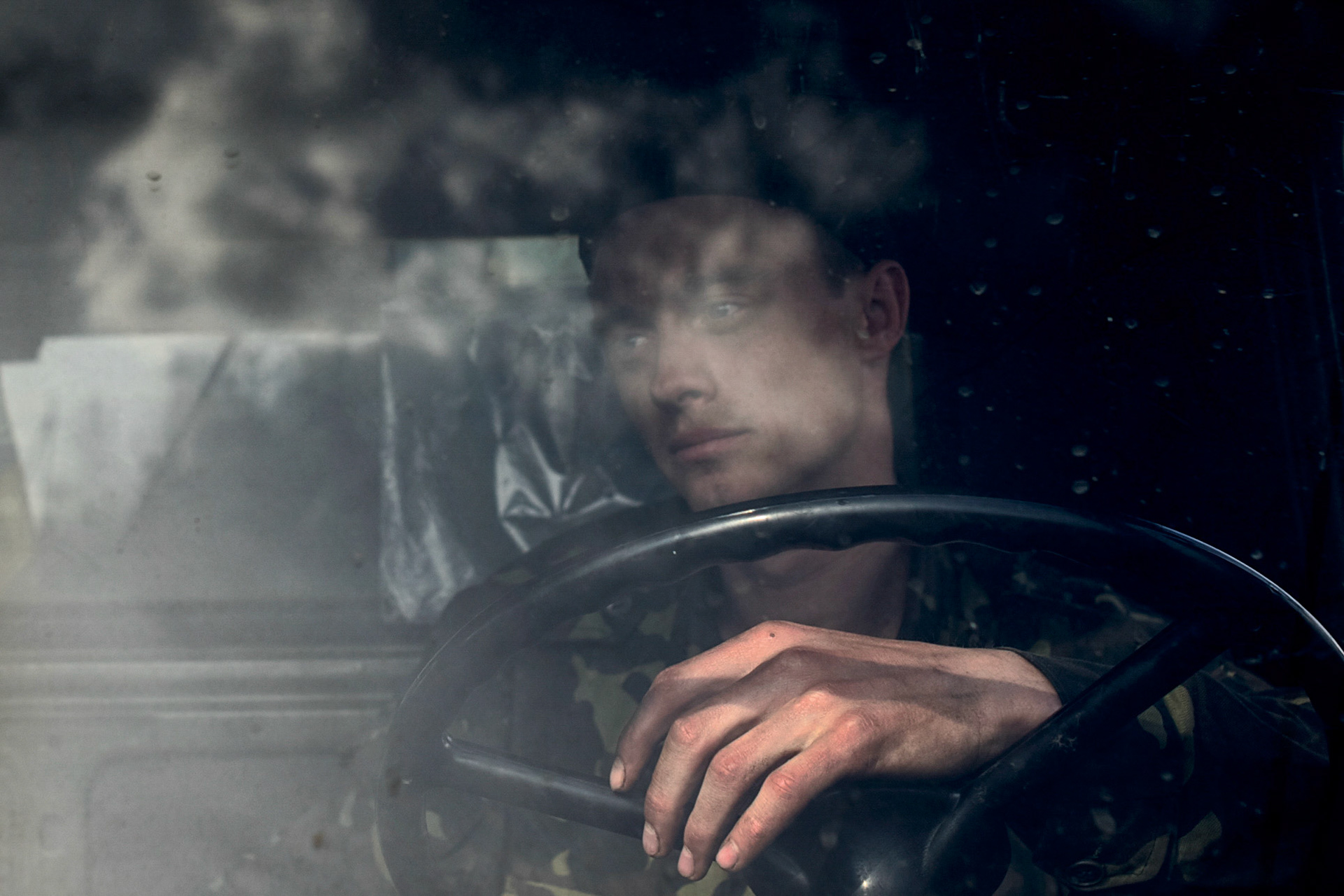 A soldier awaits orders as local activists block his convoy from passing through Kramatorsk.