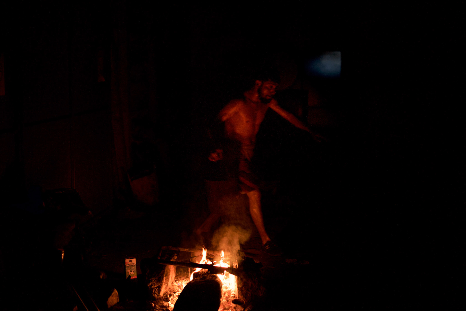 A migrant tends carries a bucket of warm water used to wash himself in the early hours at one of the abandoned warehouses in central Belgrade, used in recent months as shelter for hundreds of migrants en route to Western Europe.