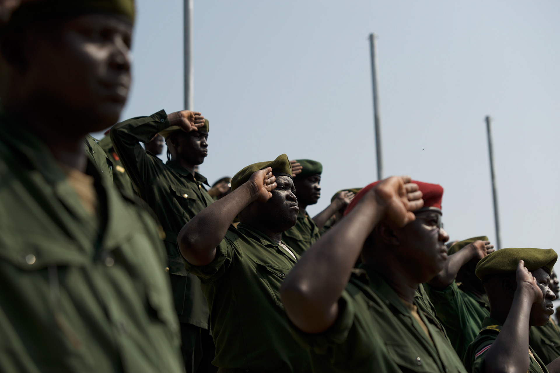 A group of SPLA commanders stand for the national anthem during a mock parade in preparation for the official ceremony marking the independence of South Sudan.