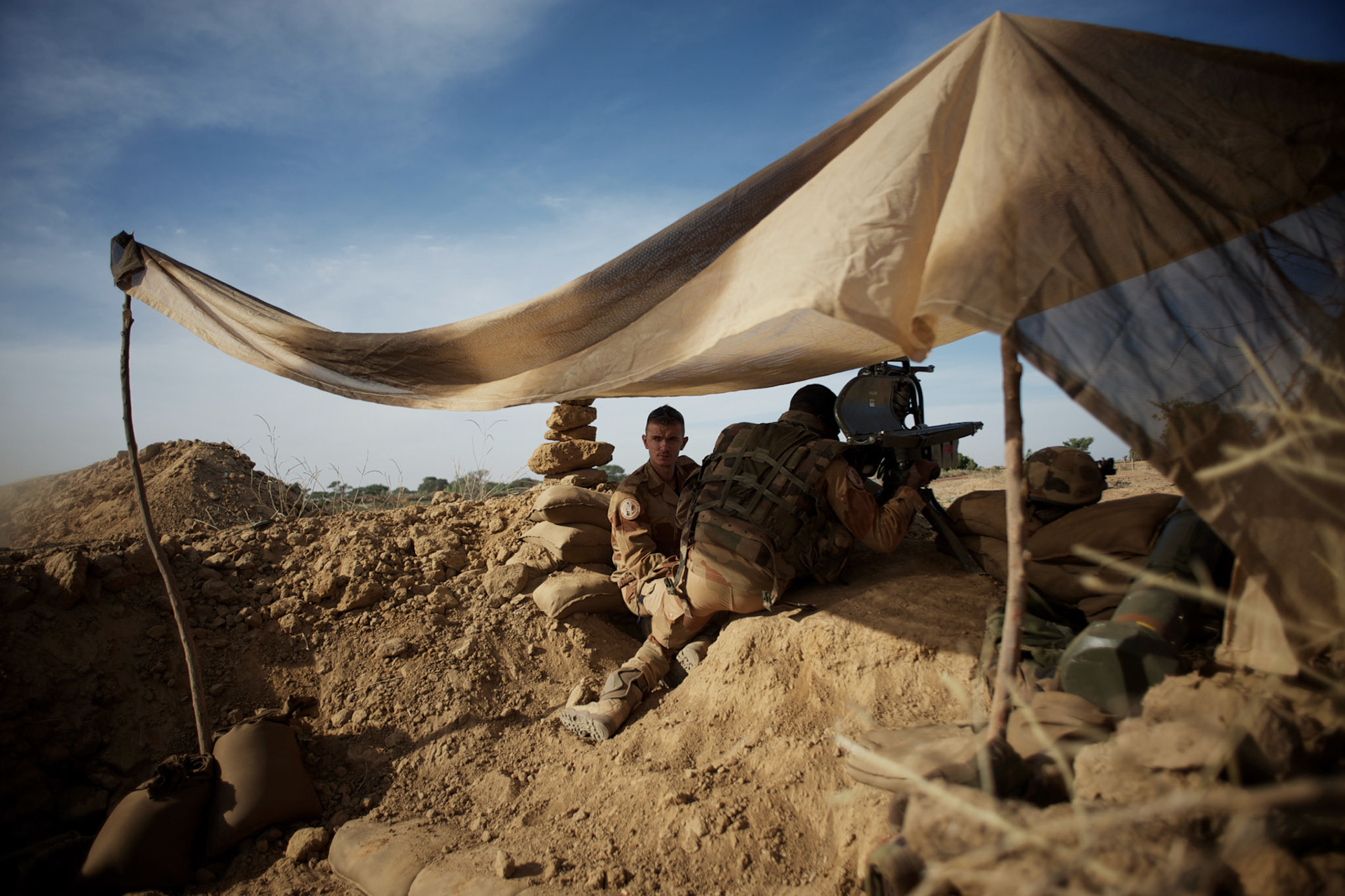January 19, 2013 - Markala, Mali: French Army men take defensive position in the outskirts of Markala, in preparation for an advance towards the northern city of Diabaly, under siege by islamist militants since the 14th of January.Several insurgent groups have been fighting a campaign against the Malian government for independence or greater autonomy for northern Mali, an area known as Azawad. The National Movement for the Liberation of Azawad (MNLA), an organisation fighting to make Azawad an independent homeland for the Tuareg people, had taken control of the region by April 2012.The Malian government pledge to the French army to help the national troops to stop the rebellion advance towards the capital Bamako. The french troops started aerial attacks on rebel positions in the centre of the country and deployed several hundred special forces men to counter attack the advance on the ground. (Paulo Nunes dos Santos)