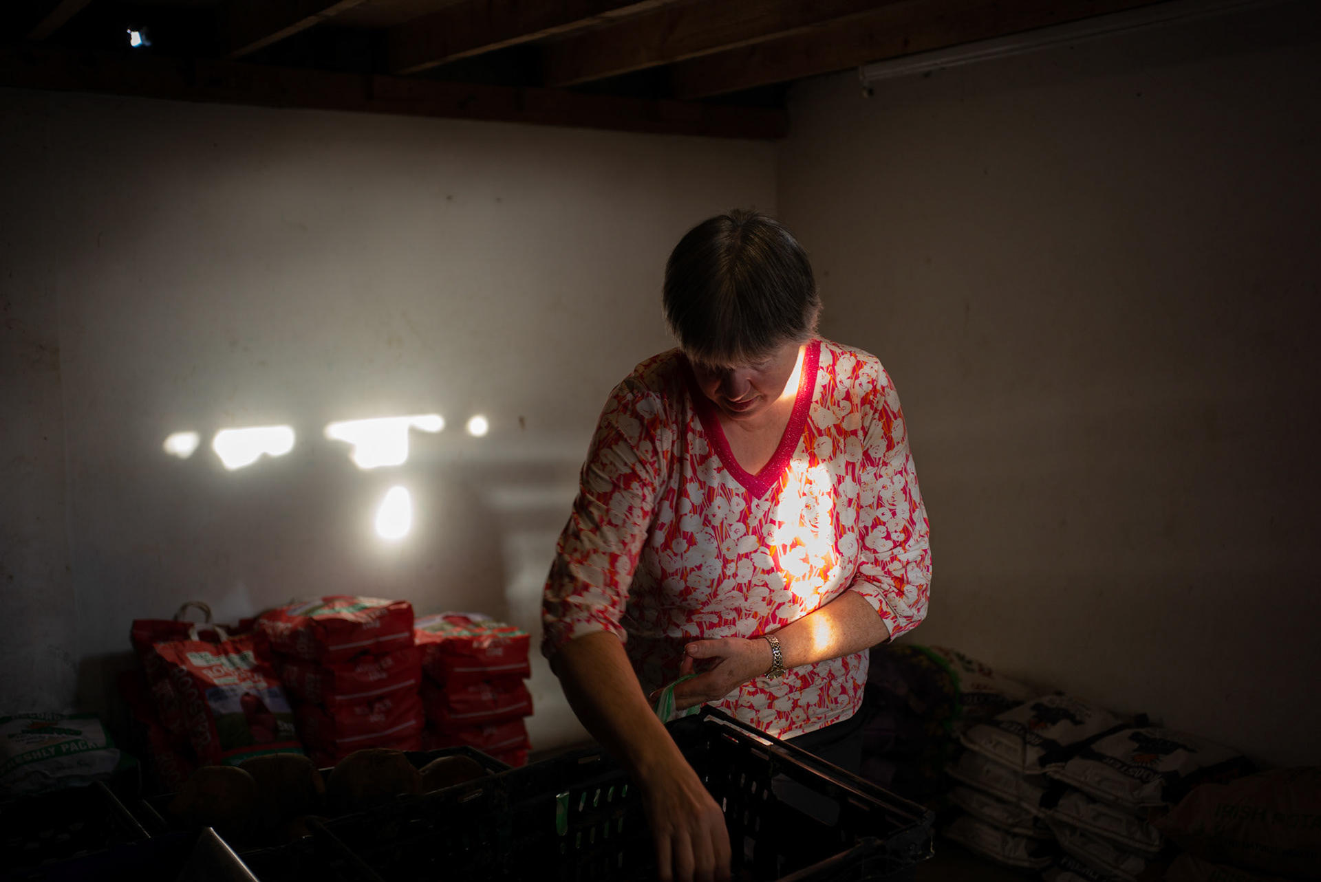 GEASHILL, IRELAND - NOVEMBER 10, 2021: Traditional faith healer, Patricia Quinn, at her potato farmhouse house in Geashill, a small village in County Offaly, Ireland, where people come to receive ‘the cure’ for various ailments. Faith healers have been around since antiquity and many Irish believe that certain people have God-given gifts to cure diseases. According to old Irish folklore, the seventh son of a seventh son has special healing powers, however, others like Patricia and her husband Peter, get ‘the cure’ passed on to them by a parent or an older relative. CREDIT: Paulo Nunes dos Santos for The New York Times