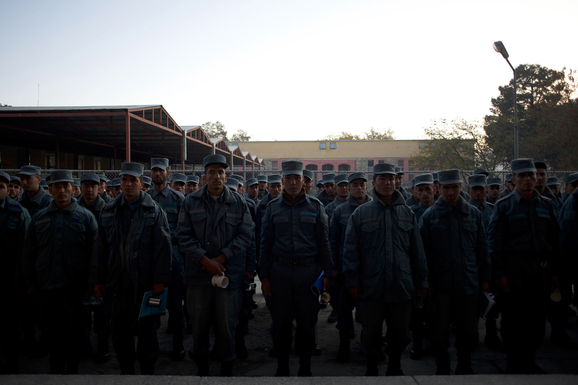 Afghan National Police (ANP) cadets line up waiting for their turn to enter the canteen for breakfast at the Afghan Nacional Police Academy in Kabul.