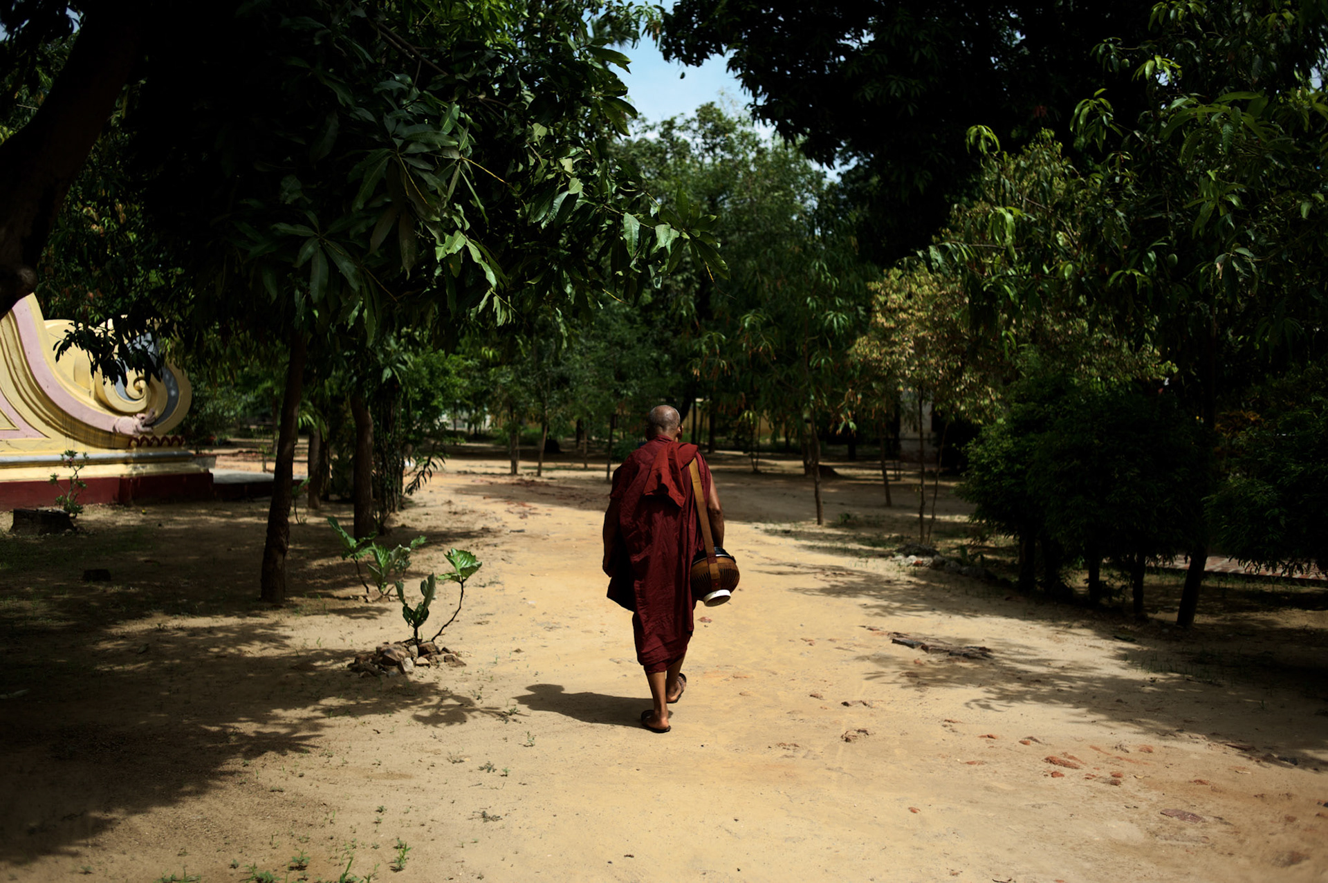 May 14, 2013 - Mandalay, Myanmar: A buddhist monk walks the grounds of a pagoda in central Mandalay. The city, famous for its pagodas, is a popular tourist destination for buddhist devotees from all over Southeast Asia. CREDIT: Paulo Nunes dos Santos