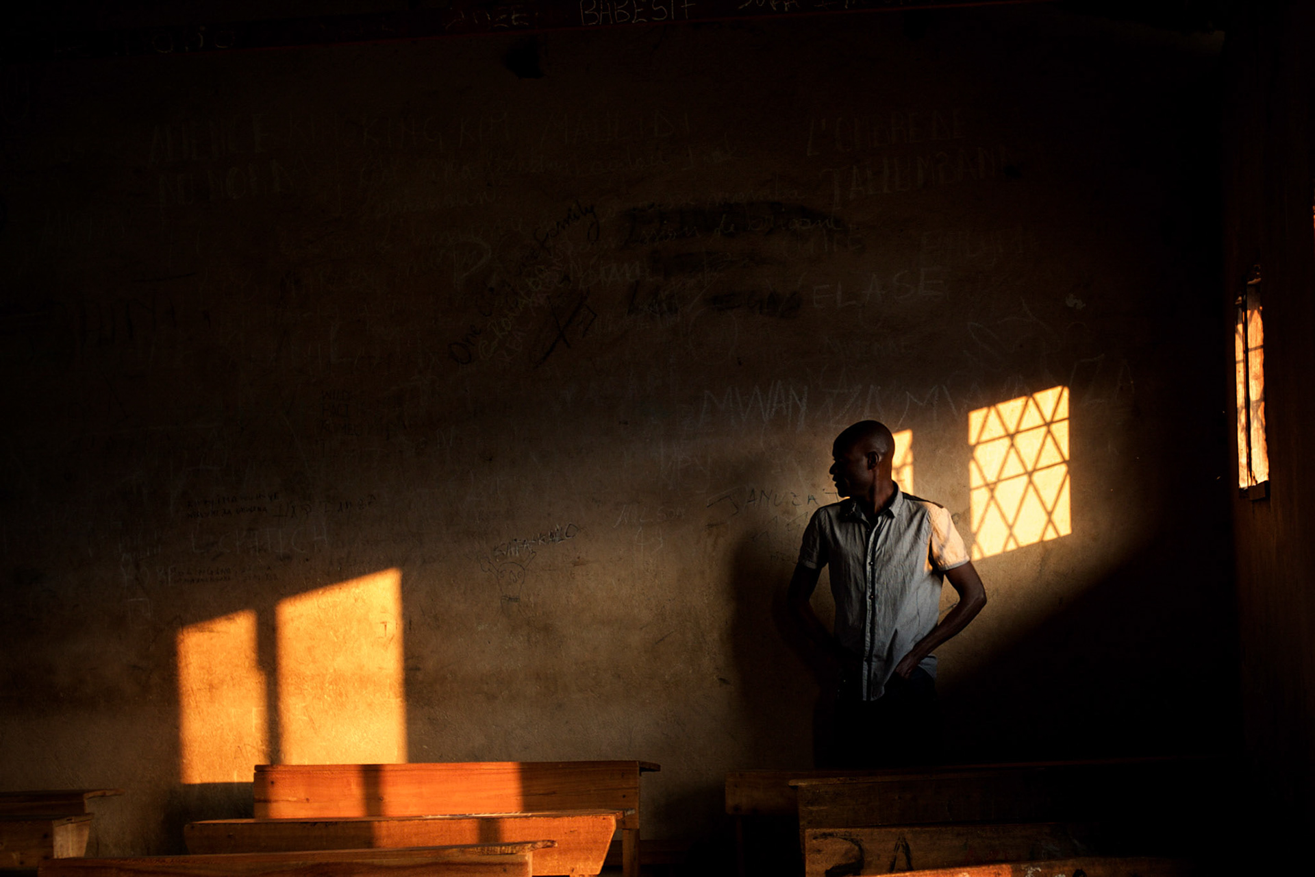 A staff member of the Burundian National Independent Electoral Commission prepare a room at a polling station in Cibitoke neighbourhood in Bujumbura, minutes before the start of the vote for the countryís parliamentary elections., on June 29, 2015.