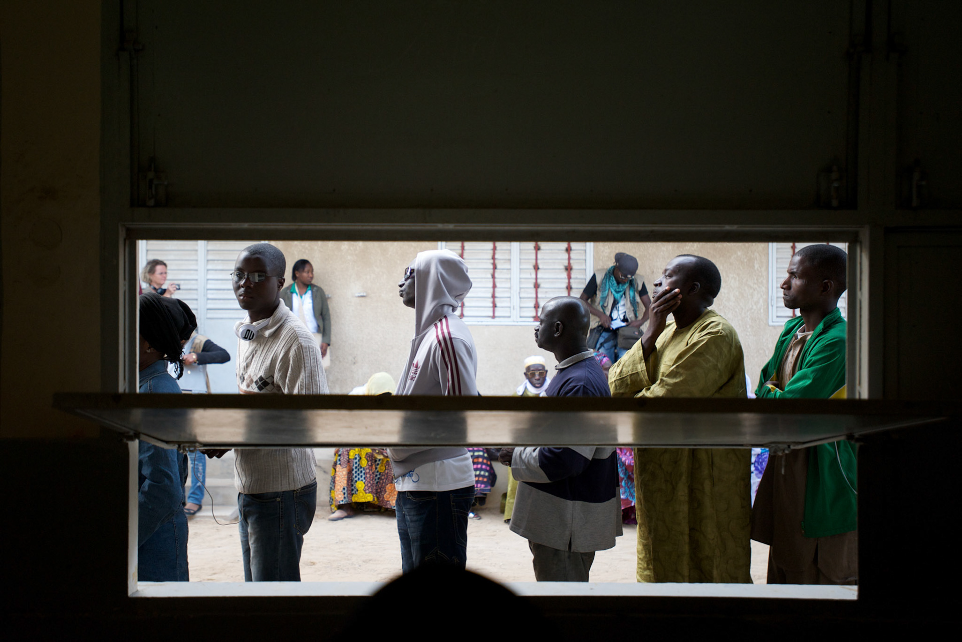 February 26, 2012 - Dakar, Senegal: People queue for voting in the senegalese presidential elections at a polling station in Franco-Arab School in Point E area of Dakar. Hundreds arriving for voting in the early hours. (Paulo Nunes dos Santos/Polaris)