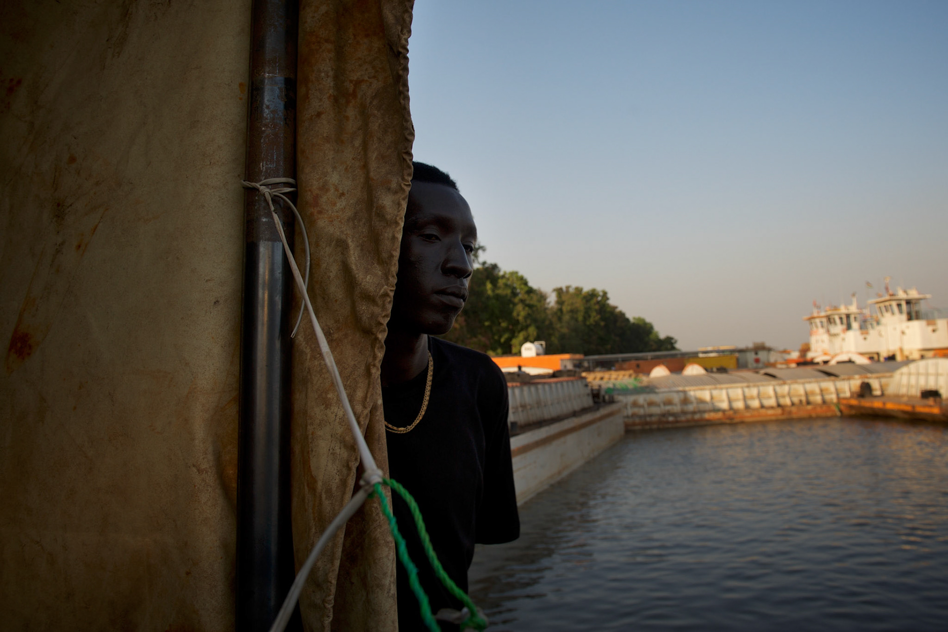 A young South Sudanese, recently arrived in Juba after years living in Khartoum, found himself stranded around Juba port awaiting aid and relocation by International NGOs.