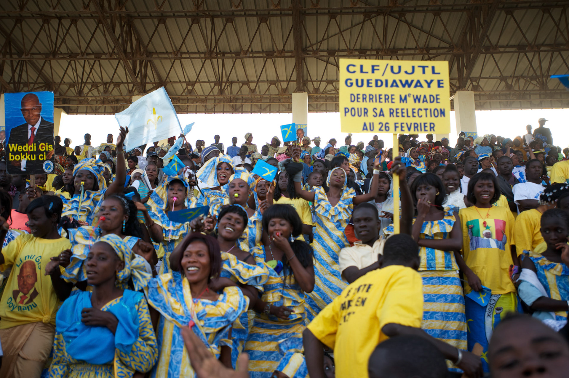 February 22, 2012 - Dakar, Senegal: A group of people react during a campaign rally for president Abdoulaye Wade in Pykine, a suburb of the capital Dakar, ahead of the presidential elections on the 26th of February.  (Paulo Nunes dos Santos/Polaris)
