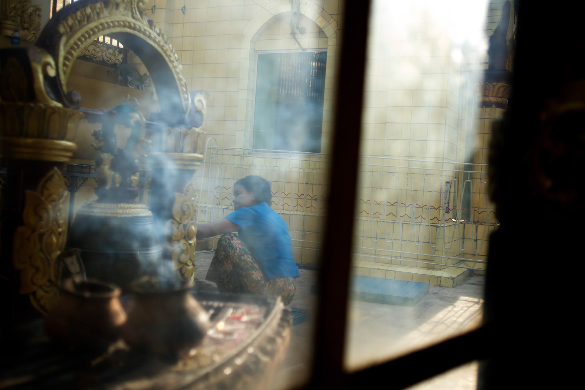 May 09, 2013 - Yangon, Myanmar: A devotee prays at Sule Pagoda in central Yangon. CREDIT: Paulo Nunes dos Santos