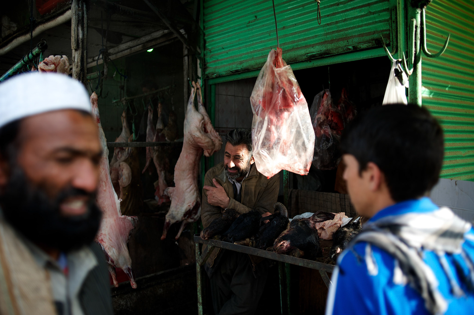 November 15, 2012 - Kabul, Afghanistan: A vendor stands at his meet stall in the market area in central Kabul. (Paulo Nunes dos Santos)
