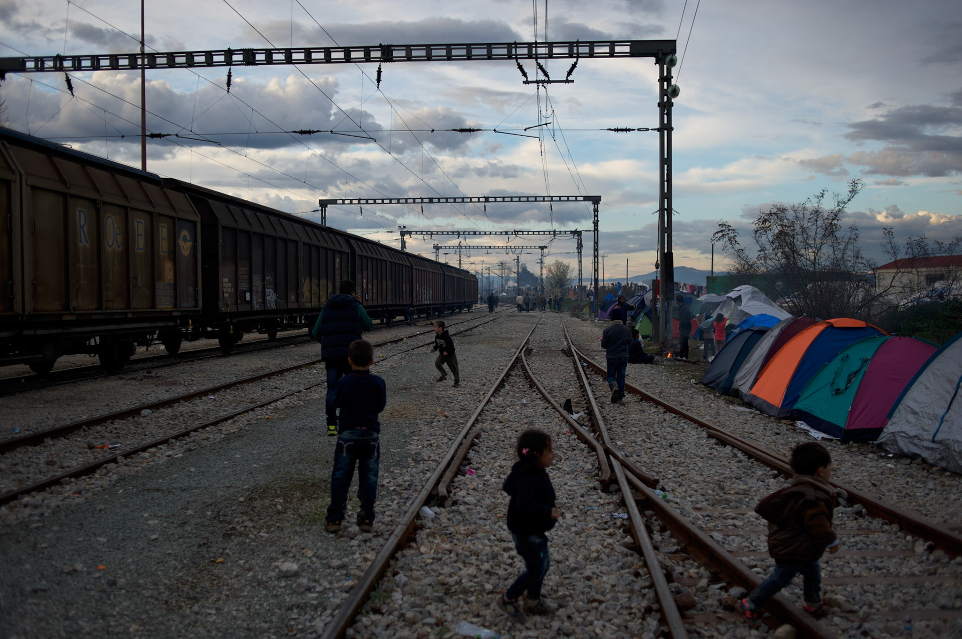 Migrant children play in the train tracks at the Greek-Macedonian border station of Idomeni, Greece. Around 13,000 migrants and refugees, mostly from the Middle East and African nations, are believe to be stranded here awaiting a chance to proceed their journey towards Germany and other northern European countries.