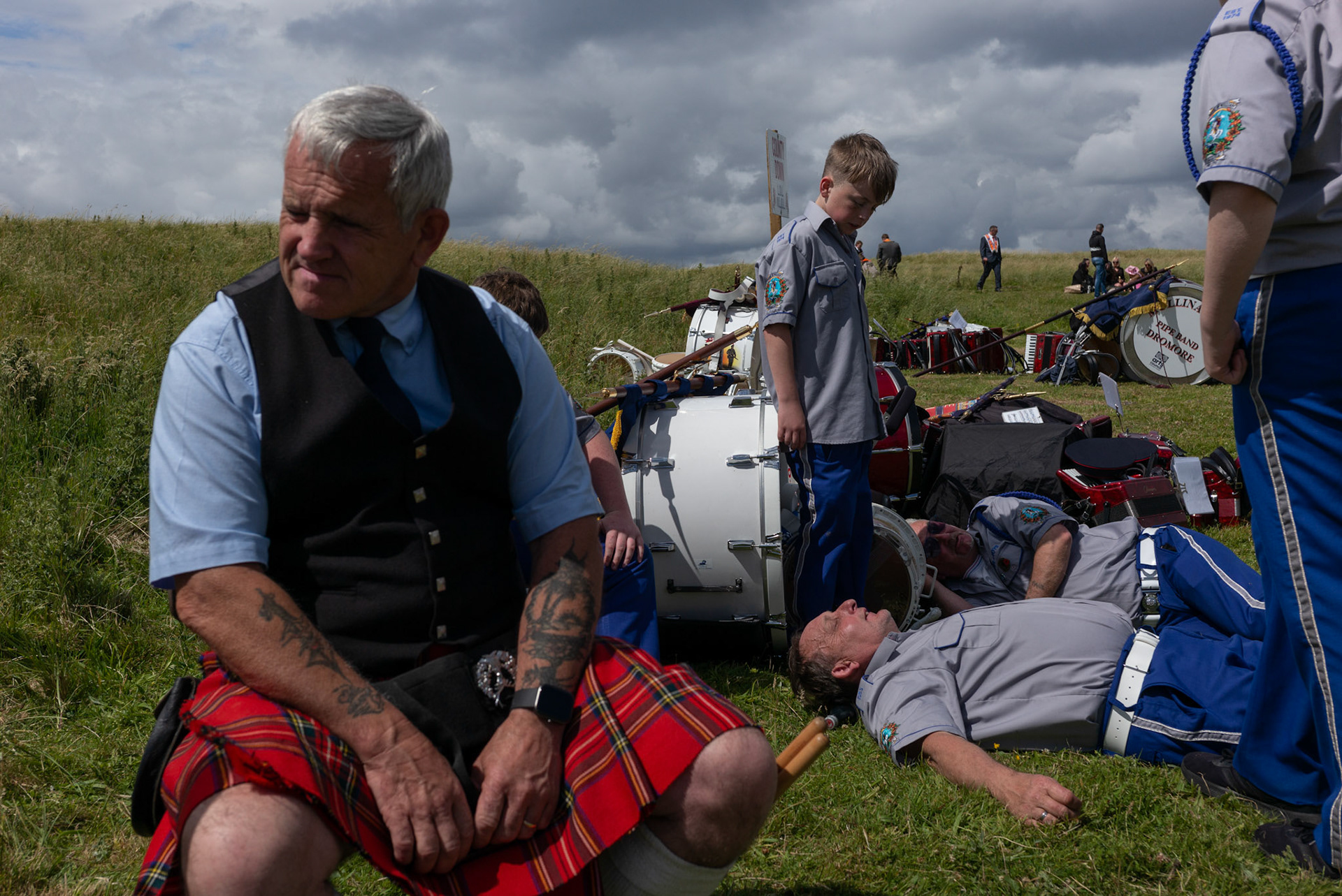 Members of a flute band take a rest after the annual Orange Order parade at Rossnowlagh Beach in Co. Donegal, Ireland, on July 6, 2024. Around 50 Orange lodges from Ireland and Northern Ireland paraded down a country lane toward the seaside village of Rossnowlagh on Saturday, the only annual Orange Order parade in the Republic of Ireland. Thousands attended the parade, which traditionally takes place on the Saturday before the main Twelfth demonstrations in Northern Ireland.