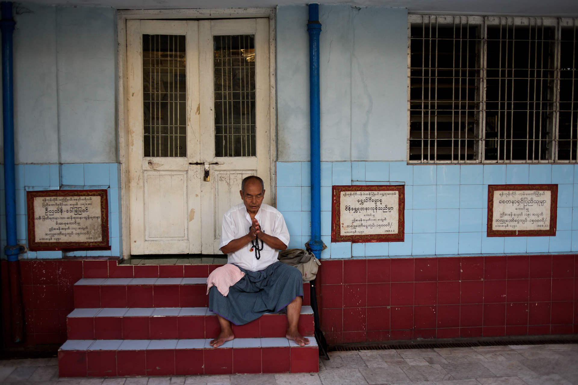 May 09, 2013 - Yangon, Myanmar: A devotee prays at Sule Pagoda in central Yangon. CREDIT: Paulo Nunes dos Santos