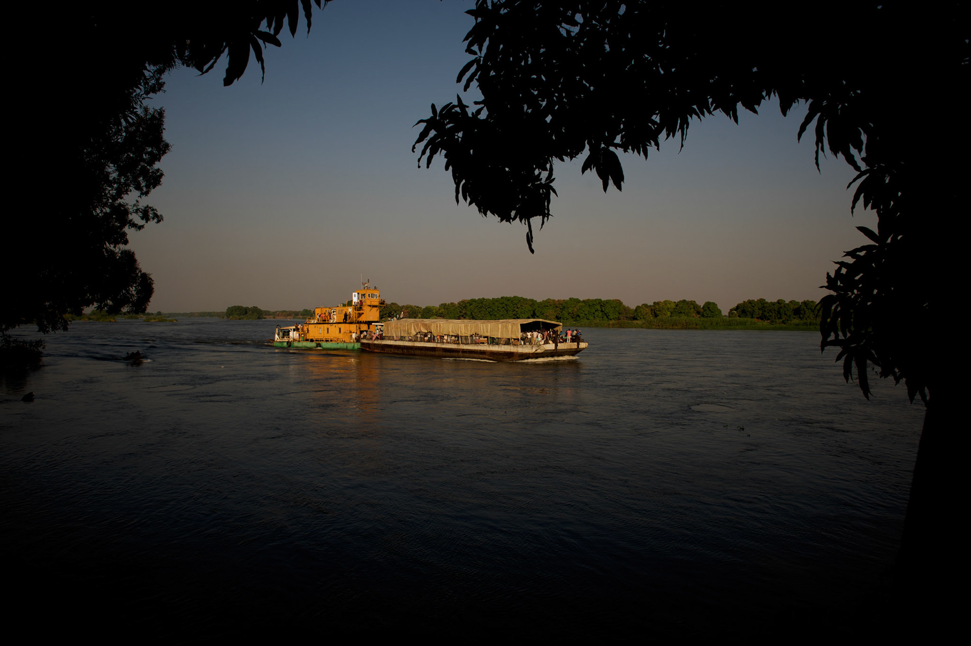 A barge carrying around 400 south sudanese men and women arrives at Juba port the day before the referendum for independence of South Sudan.