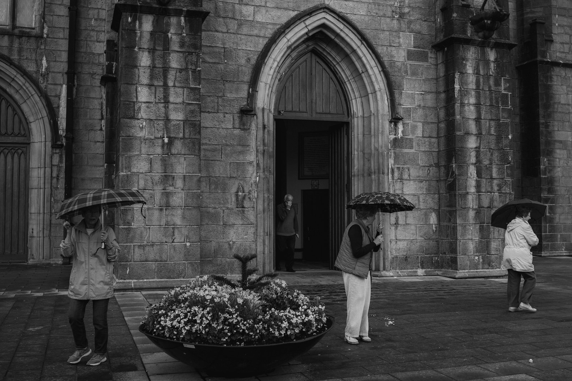 TUAM, IRELAND - AUGUST 23, 2017: Locals leave mass at Cathedral of the Assumption of the Blessed Virgin Mary, in Tuam. The centenary cathedral is the town’s epicentre, with all schools and convents built in the surrounding area. CREDIT: Paulo Nunes dos Santos for The New York Times