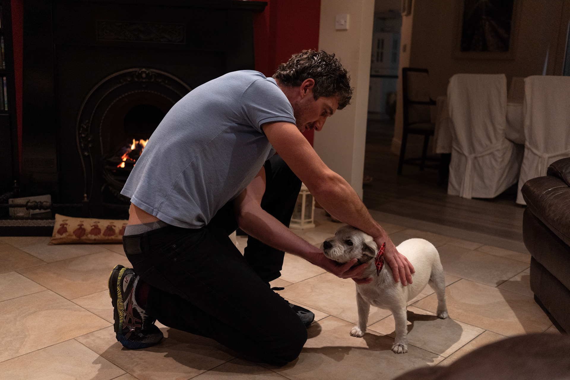 BALLINA, IRELAND - NOVEMBER 11, 2021: Faith Healer, Andrew Keane performed “the cure” for ring worms on two dogs from a neighbouring house in Cloghans, a small location outside Ballina in County Mayo, Ireland. A construction worker by trade, Mr. Keane is just one of hundreds dotted across the country who are healers or have “the cure” as it’s commonly known here. Some, like him, are seventh sons, believed for generations to be healers, but others are keepers of customs passed down through their families that range from rituals, prayers and charms to herbal tinctures that are offered up as remedies for everything from burns to sprains to shingles and other ailments. CREDIT: Paulo Nunes dos Santos for The New York Times