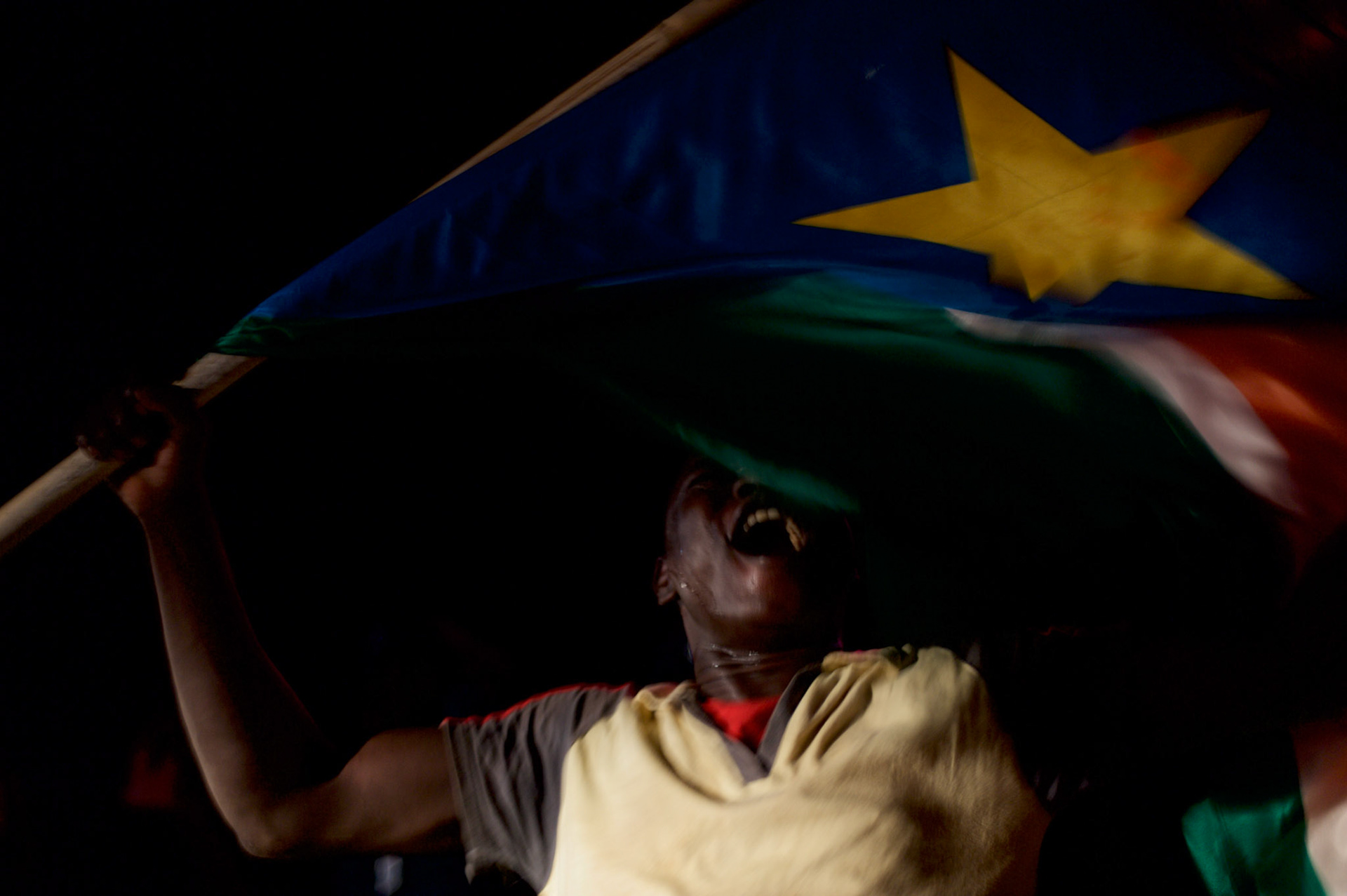 A man waves the South Sudan flag, in central juba, during celebrations for the independence of South Sudan.