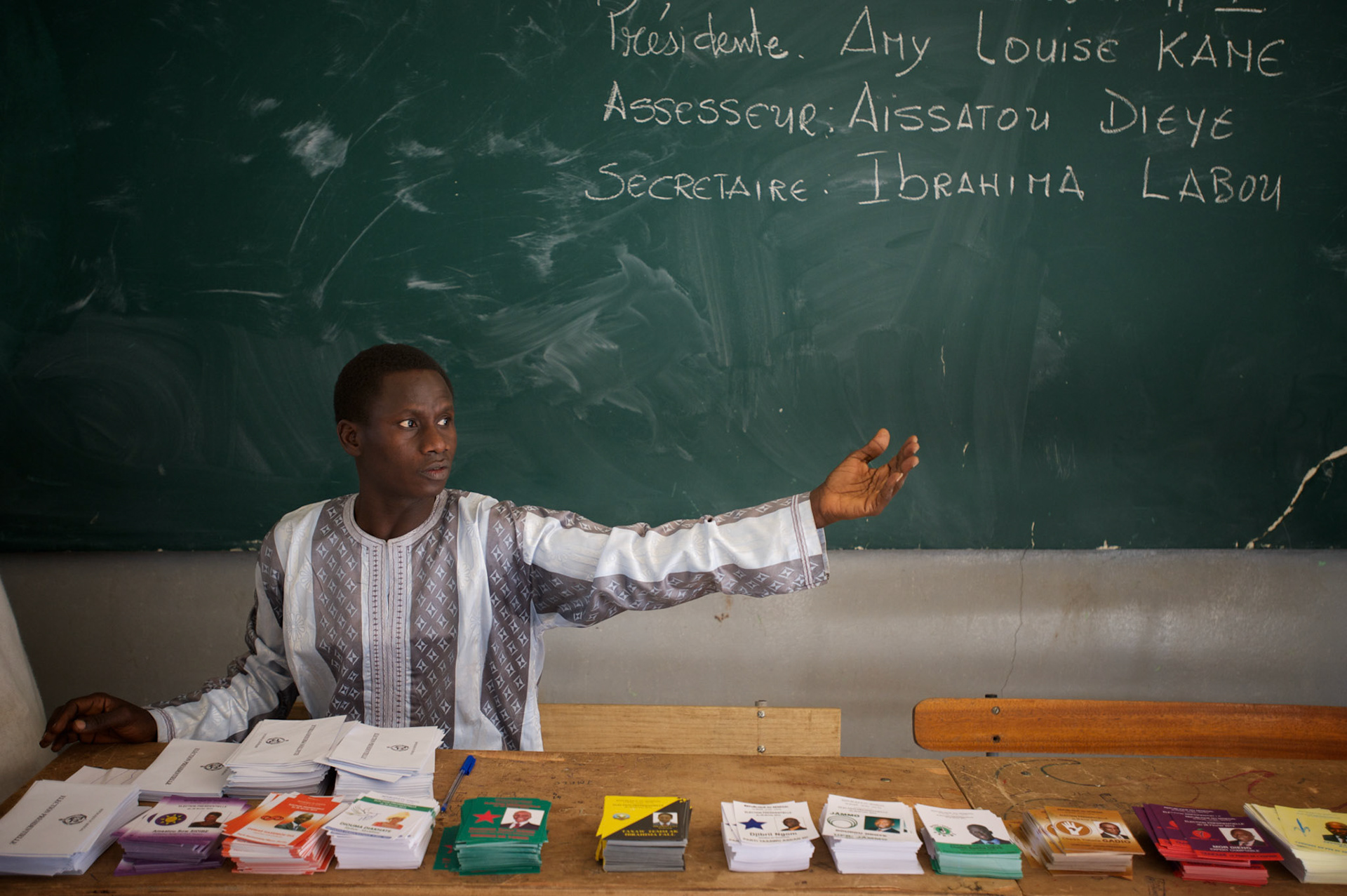 February 26, 2012 - Dakar, Senegal: An election commissioner calls an elector to vote for the senegalese presidential elections at a polling station in Franco-Arab School in Point E area of Dakar. Hundreds arriving for voting in the early hours. (Paulo Nunes dos Santos/Polaris)