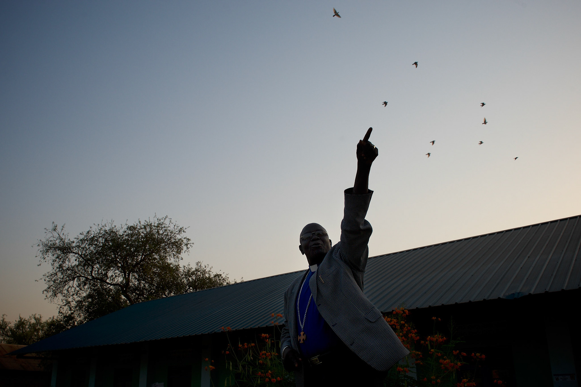 A priest addresses an audience of voters outside a polling station in central Juba, ahead of the seven day referendum for the independence of Southern Sudan.