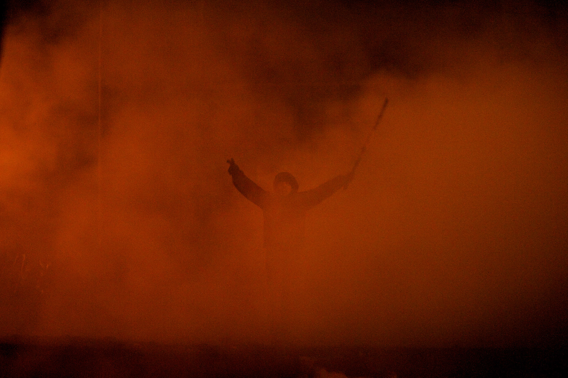 January 24, 2014 - Kiev, Ukraine: A protestor, evolved in smoke, shouts provocative words towards the Ukrainian riot police forces at a defensive barricade near Dynamo Kiev's stadium in central Kiev. (Paulo Nunes dos Santos)