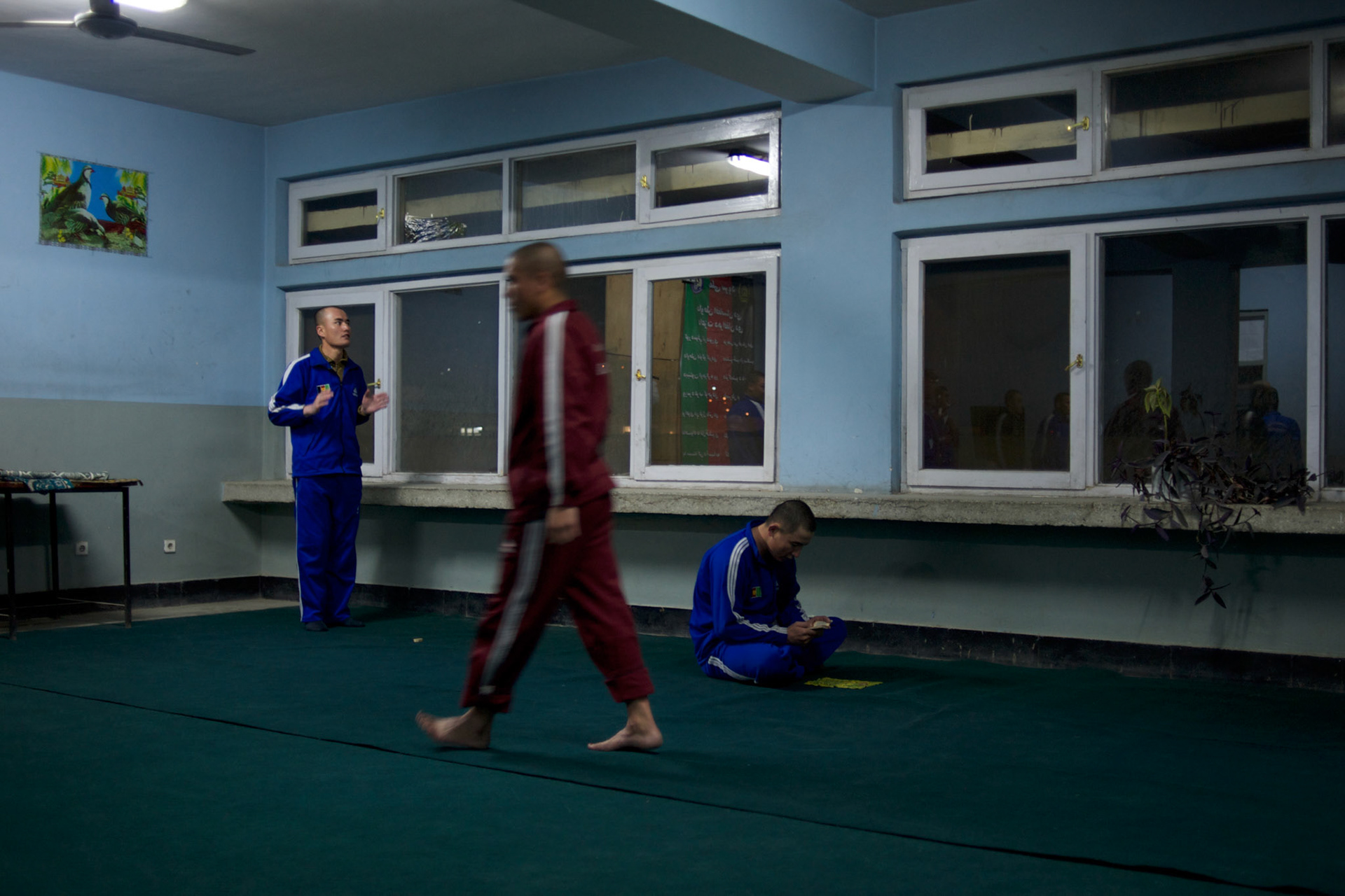 Afghan National Police (ANP) cadet during morning pray in a dorm at the Afghan Nacional Police Academy in Kabul.