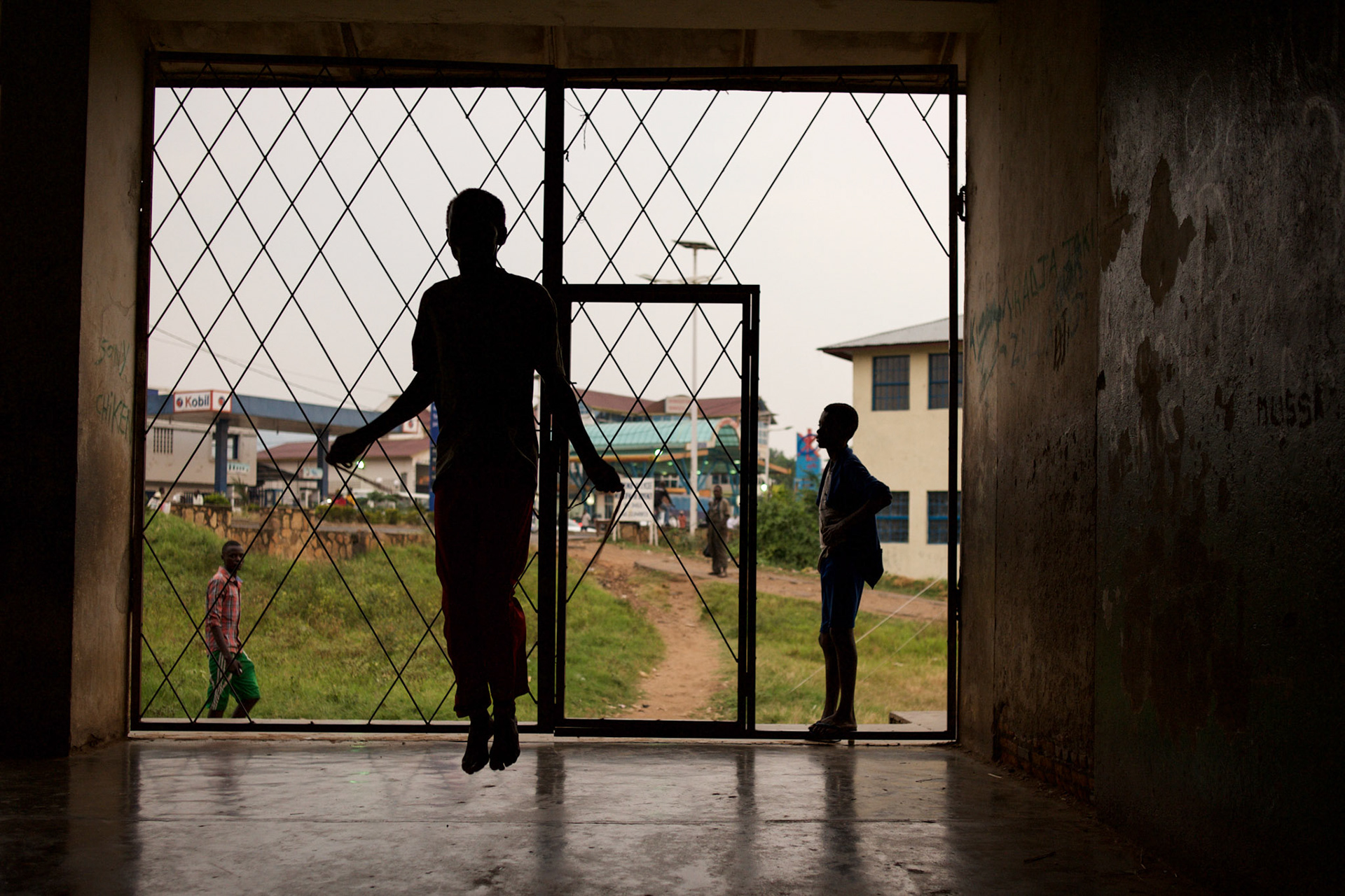 A red cross volunteer exercises at a local school in central Bujumbura, Burundi.