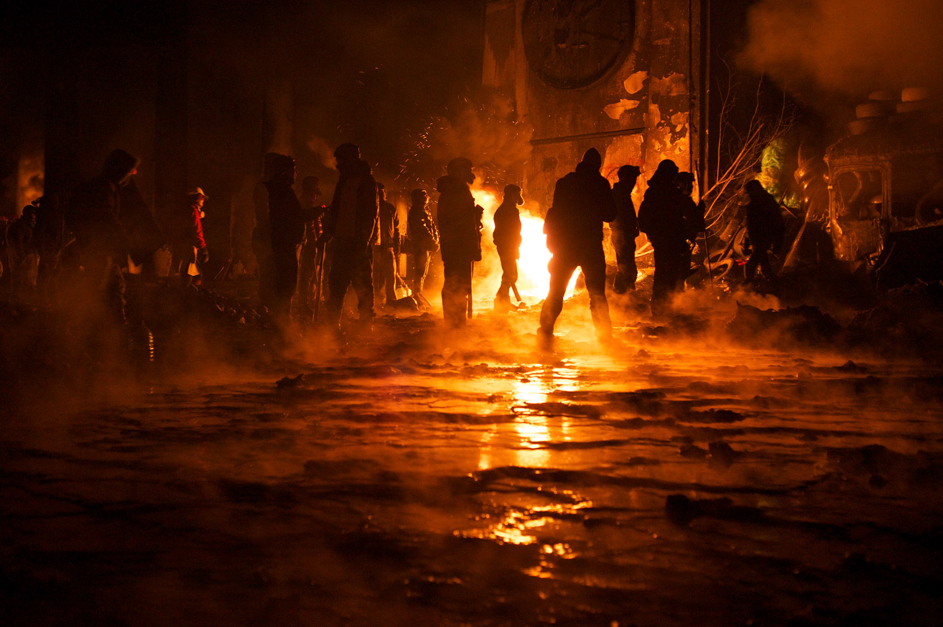 January 24, 2014 - Kiev, Ukraine: Protestors stand guard near a defensive barricade near Dynamo Kiev's stadium in central Kiev. (Paulo Nunes dos Santos)