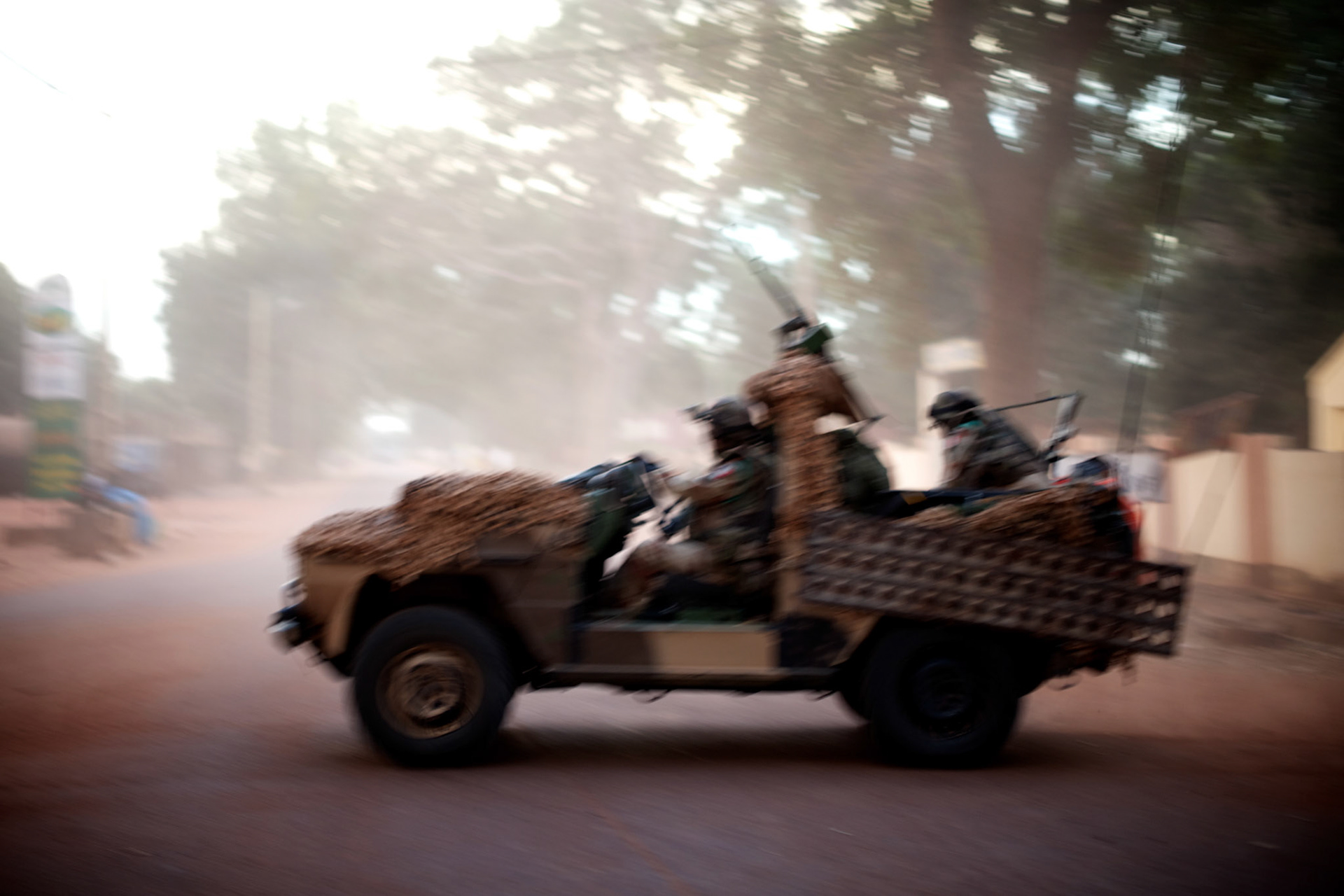 January 19, 2013 - Niono, Mali: French Army men gather in Niono's main square near the Mali police headquarters. Niono is the last government controlled location before Diabaly, a city under islamist militants control since the 14th of January.Several insurgent groups have been fighting a campaign against the Malian government for independence or greater autonomy for northern Mali, an area known as Azawad. The National Movement for the Liberation of Azawad (MNLA), an organisation fighting to make Azawad an independent homeland for the Tuareg people, had taken control of the region by April 2012.The Malian government pledge to the French army to help the national troops to stop the rebellion advance towards the capital Bamako. The french troops started aerial attacks on rebel positions in the centre of the country and deployed several hundred special forces men to counter attack the advance on the ground. (Paulo Nunes dos Santos)