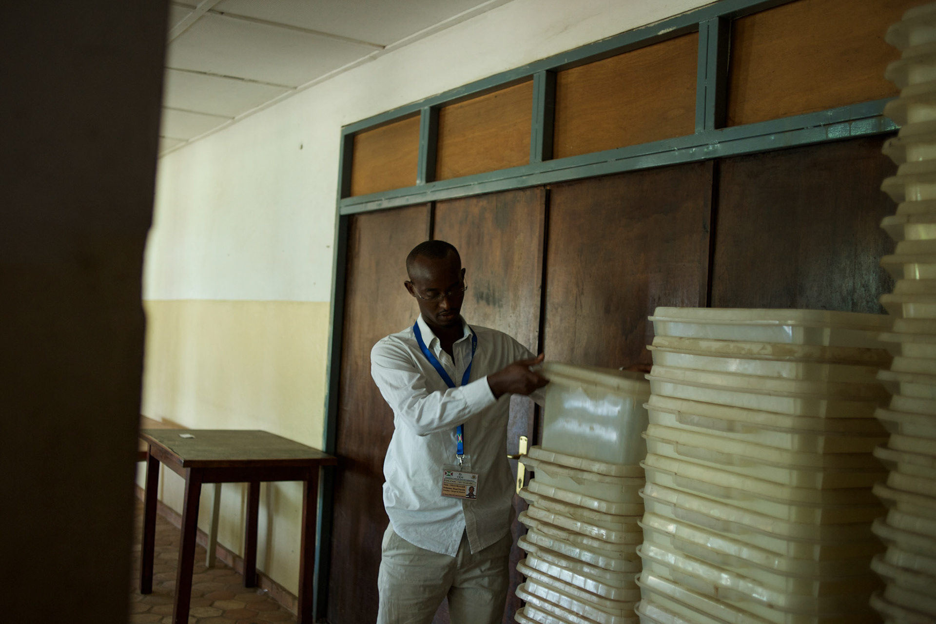 A member of Burundi's National Electoral Commission counts the ballot boxes at a warehouse being used to store electoral material for the upcoming parliamentary elections, in Niykabiga neighbourhood, Bujumbura, June 28th, 2015.