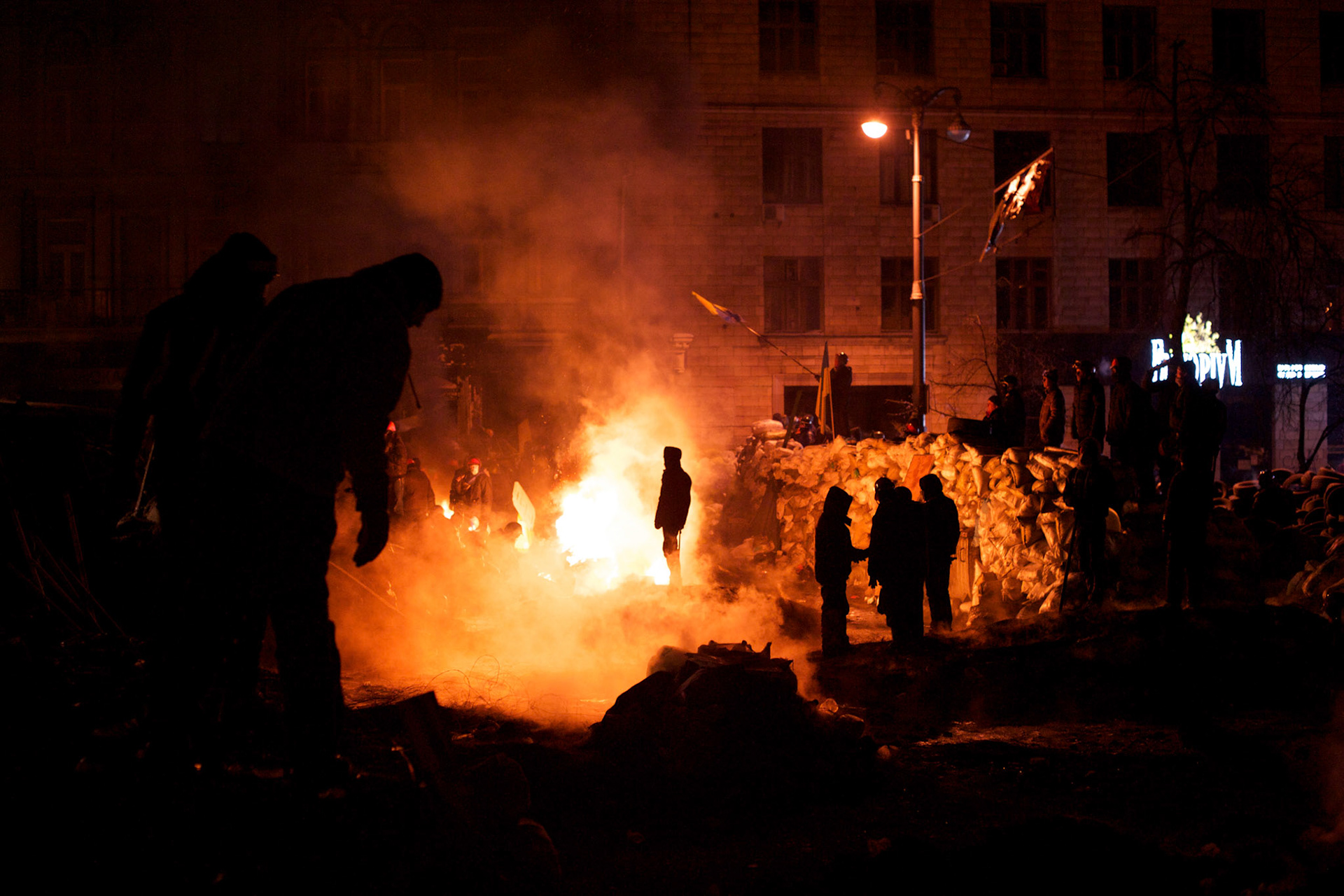 January 24, 2014 - Kiev, Ukraine: Protestors stand guard near a defensive barricade near Dynamo Kiev's stadium in central Kiev, as temperatures drop to minus 15 degrees celsius. (Paulo Nunes dos Santos)