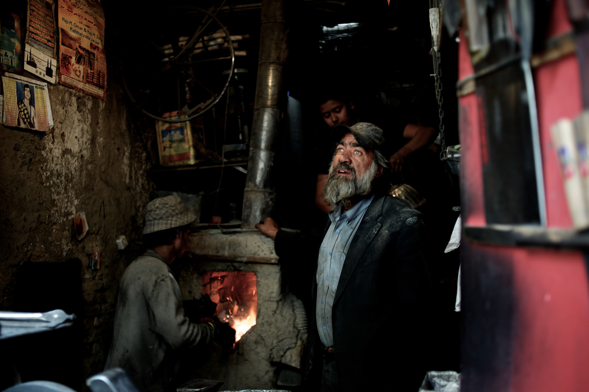 November 15, 2012 - Kabul, Afghanistan: A family of blacksmiths makes knifes and blades to be used during Ashura festival, in a workshop at the bird's bazaar in central Kabul. (Paulo Nunes dos Santos)