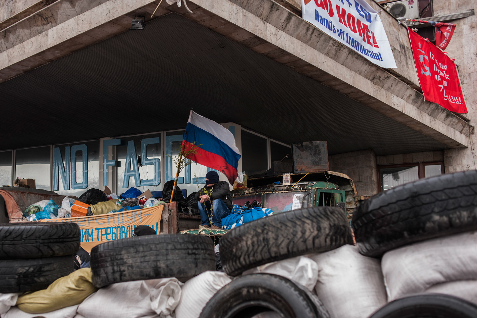 A separatist mans barricades surrounding the regional government building in Donetsk.