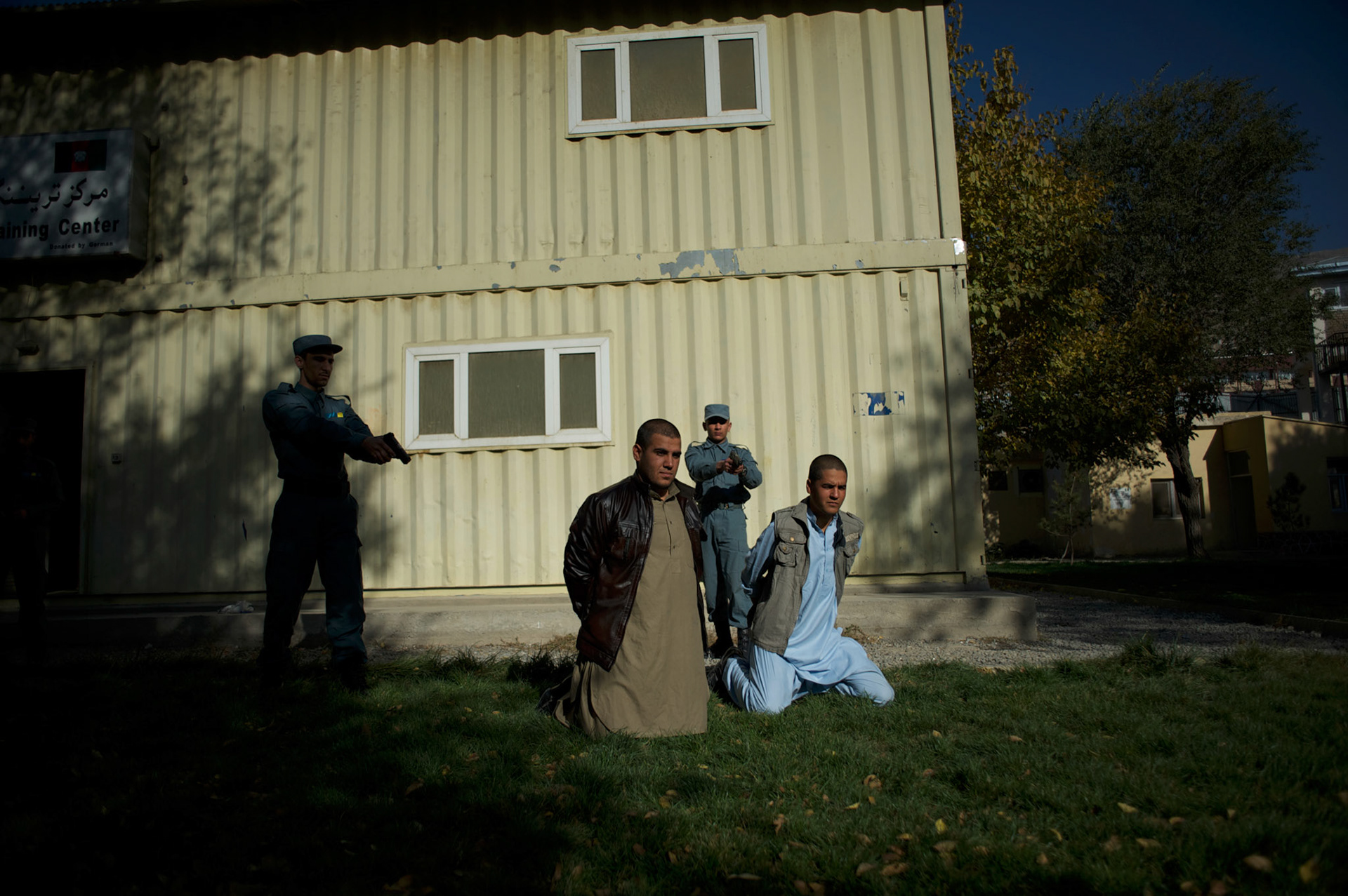 Afghan National Police (ANP) cadets simulate the arrest of Talibans during combat exercises at the Afghan Nacional Police Academy in Kabul.