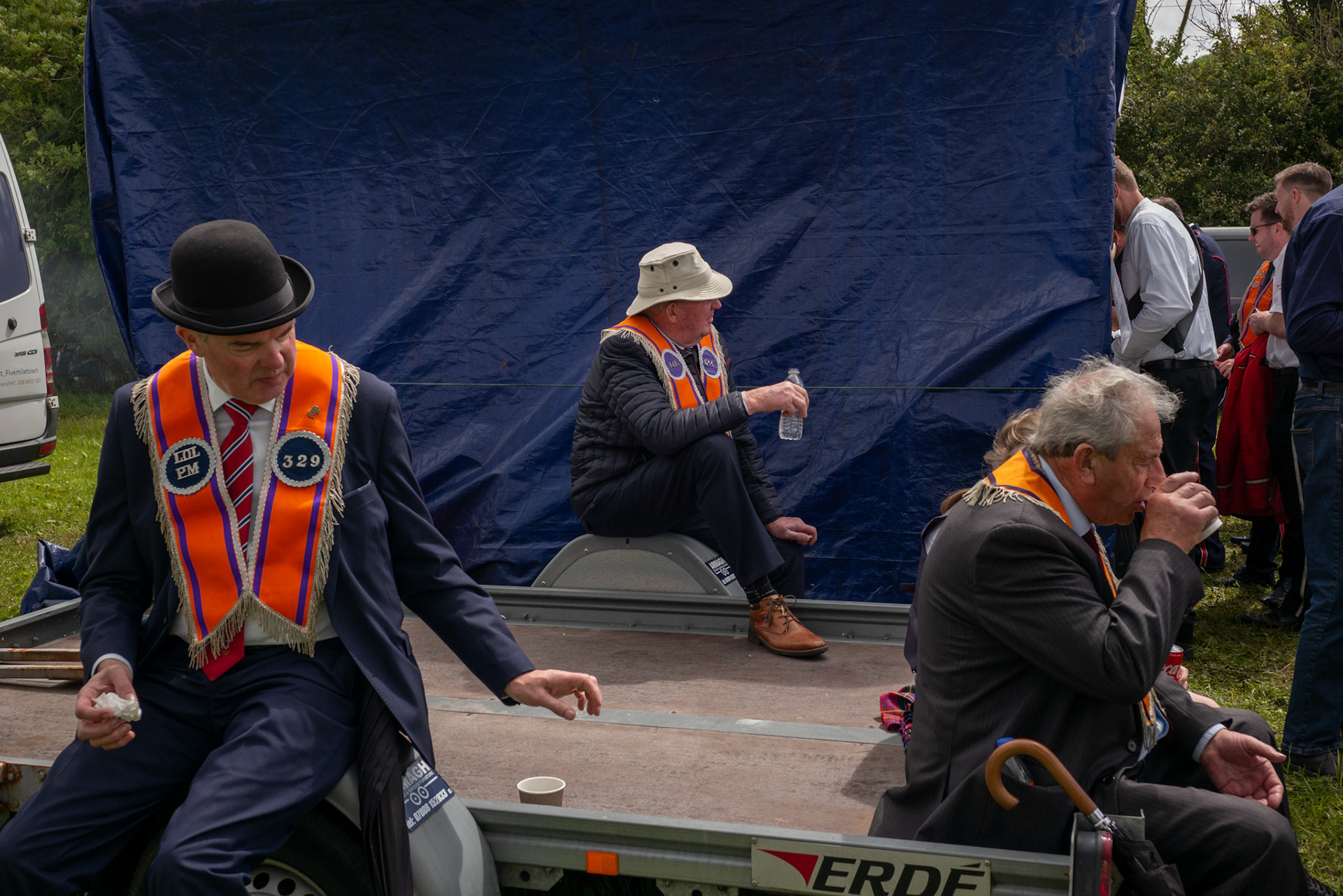 Orangemen have a drink ahead of the annual Orange Order parade at Rossnowlagh Beach in Co. Donegal, Ireland, on July 6, 2024. Around 50 Orange lodges from Ireland and Northern Ireland paraded down a country lane toward the seaside village of Rossnowlagh on Saturday, the only annual Orange Order parade in the Republic of Ireland. Thousands attended the parade, which traditionally takes place on the Saturday before the main Twelfth demonstrations in Northern Ireland.