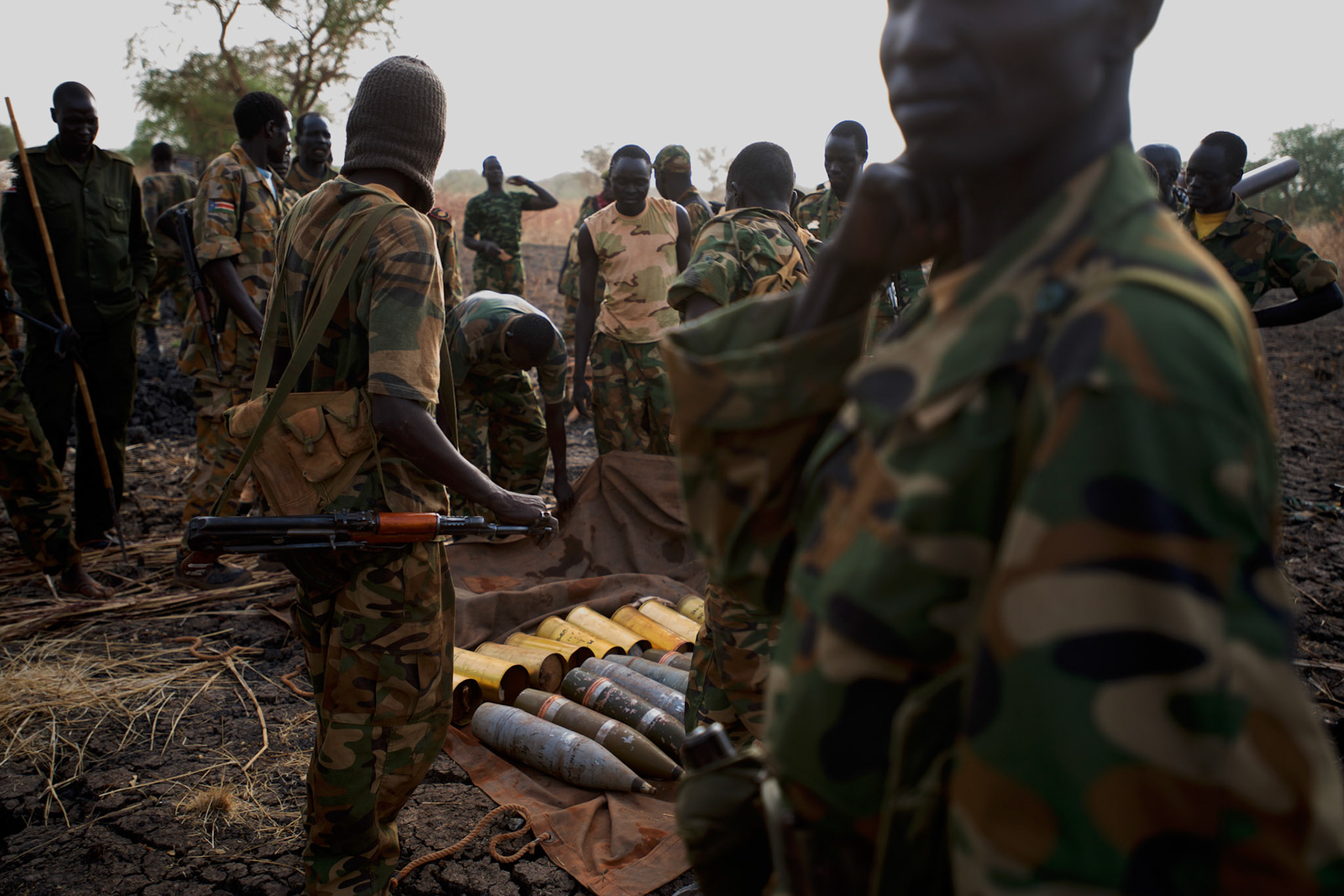 A group of SPLA soldiers prepares mortar shells at the last defensive line, outside the village of Panakuach, north of Bentiu, during combats between South Sudan military and the neighbouring Sudan over the control of oil fields in a disputed border area.