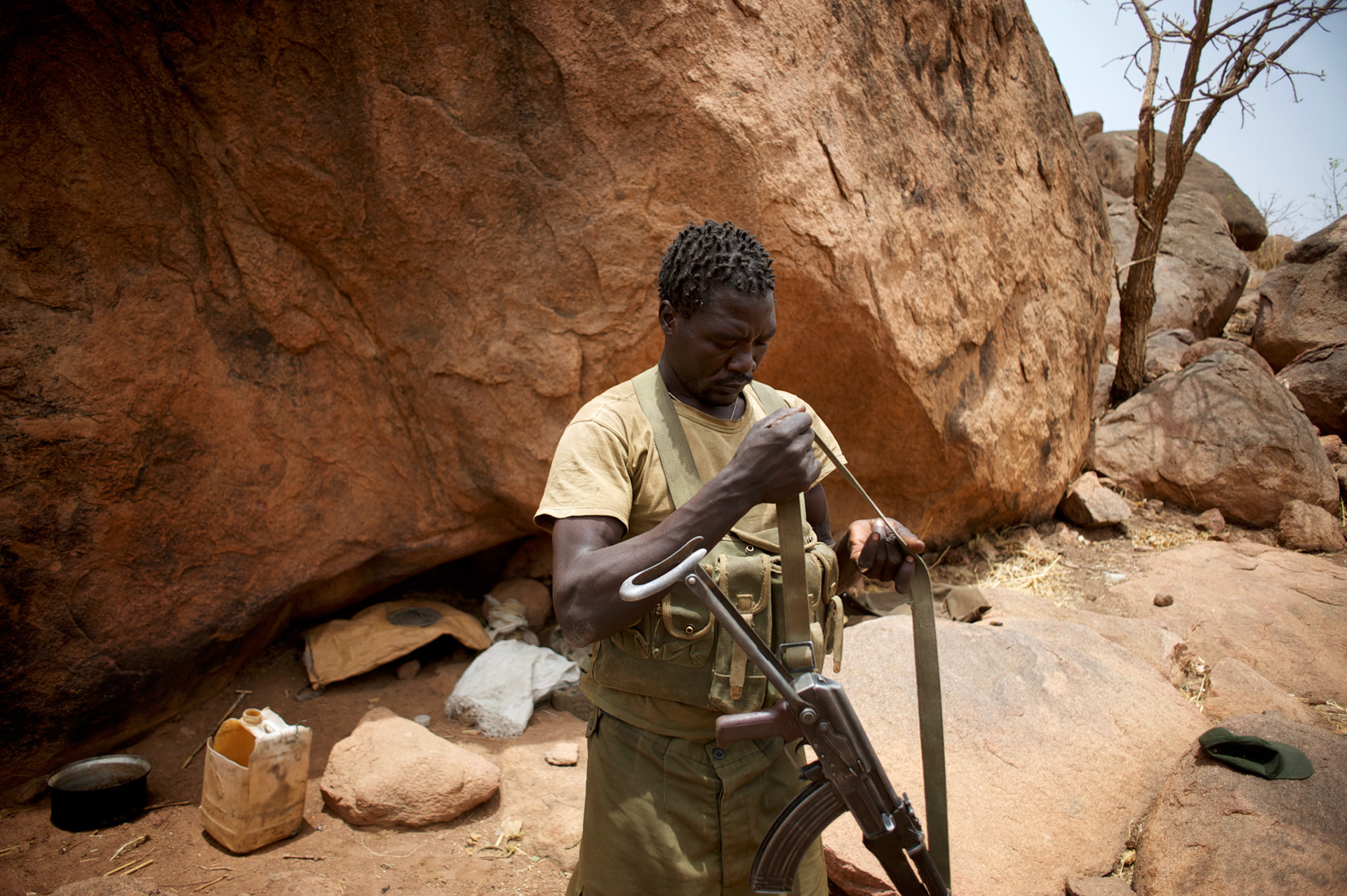 A Sudan People's Liberation Movement (SPLA-N) rebel fighter prepares his weapons for an attack on Sudan's Armed Forces (SAF) positions near Tess village in the rebel-held territory of the Nuba Mountains in South Kordofan.