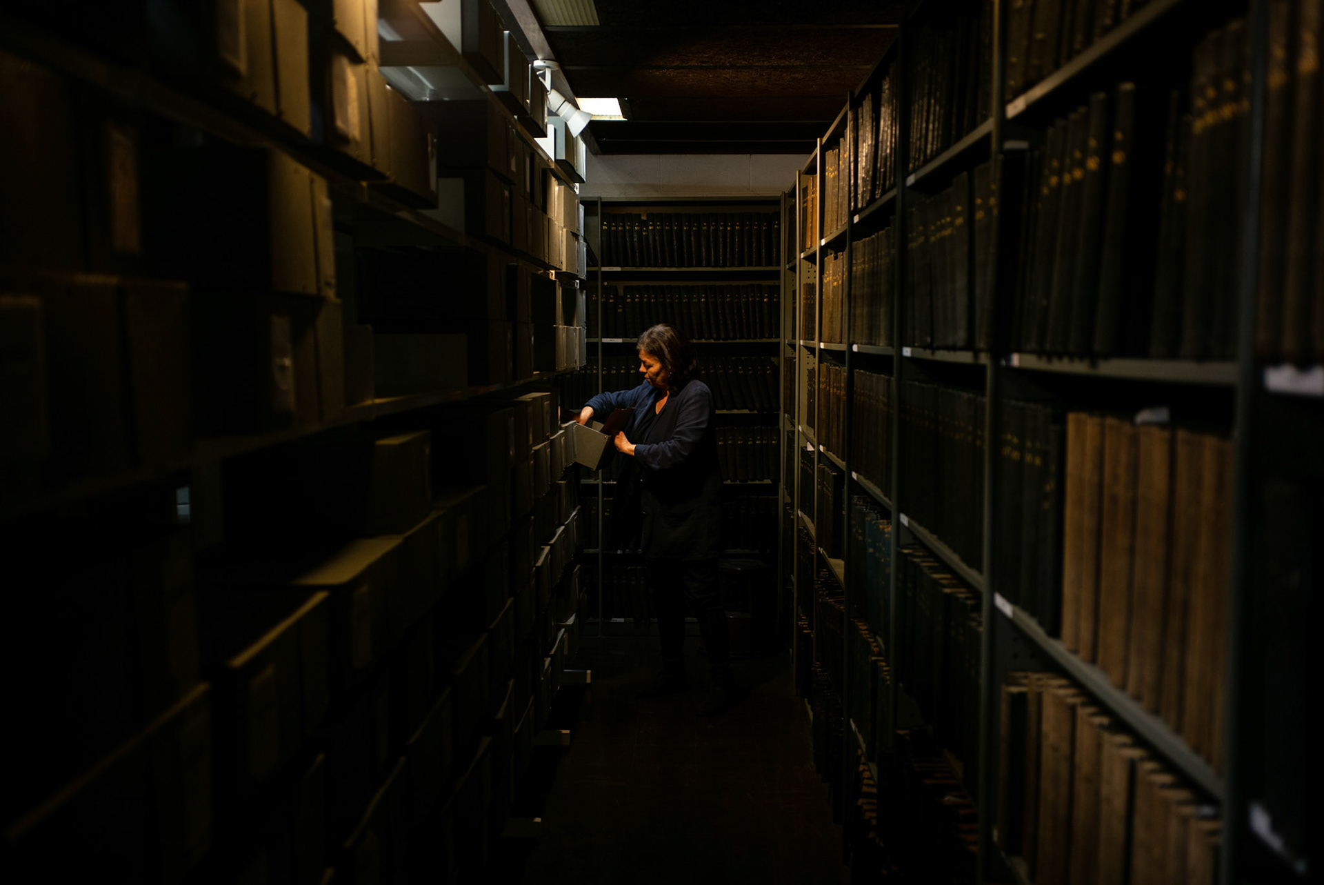 DUBLIN, IRELAND - NOVEMBER 24, 2021: Dr. Bairbre Ní Fhloinn, the Head of Subject in Irish Folklore, in the School of Irish, Celtic Studies and Folklore at University College of Dublin, browses through archives at the Belfield Campus in South Dublin, Ireland. CREDIT: Paulo Nunes dos Santos for The New York Times