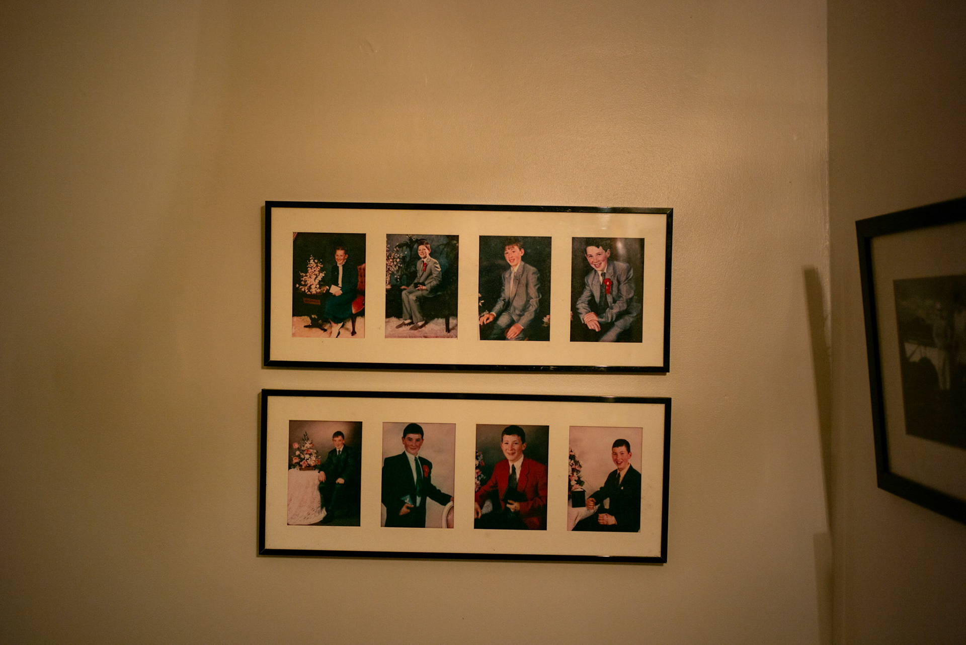 BALLINA, IRELAND - NOVEMBER 11, 2021: Portraits of Faith Healer, Andrew Keane (bottom-right) and his siblings, can be seen hanging on a wall at the farmhouse he grew up in Cloghans, a small location outside Ballina in County Mayo, Ireland. A construction worker by trade, Mr. Keane is just one of hundreds dotted across the country who are healers or have “the cure” as it’s commonly known here. Some, like him, are seventh sons, believed for generations to be healers, but others are keepers of customs passed down through their families that range from rituals, prayers and charms to herbal tinctures that are offered up as remedies for everything from burns to sprains to shingles and other ailments. CREDIT: Paulo Nunes dos Santos for The New York Times