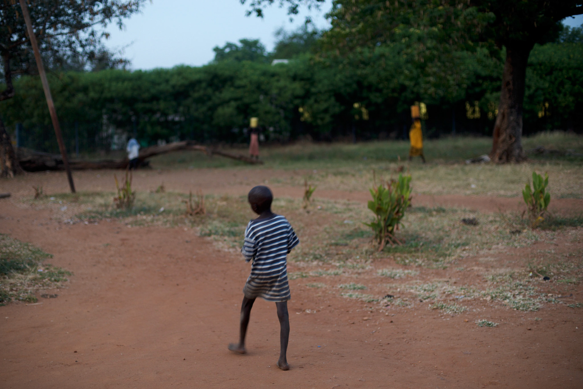 A orphan child walks by the main yard of the Orphanage Home of Juba, a shelter build for children who lost their parents during the war.