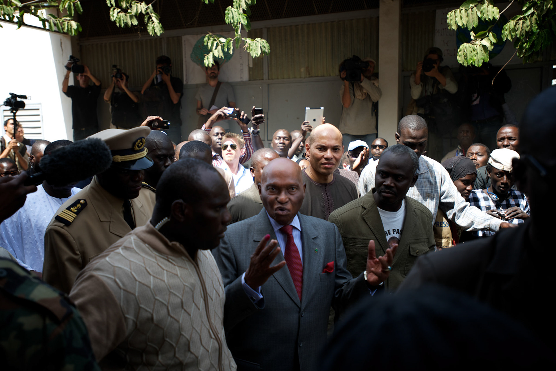 February 26, 2012 - Dakar, Senegal: Senegal's president and candidate, Abdoulaye Wade, leaves the polling station in the Franco-Arab School in Point E area of Dakar. Hundreds of people queueing for voting insulted and heckled Wade, accusing the head of state of disrespect for the country's constitution when running for a third mandate. (Paulo Nunes dos Santos/Polaris)