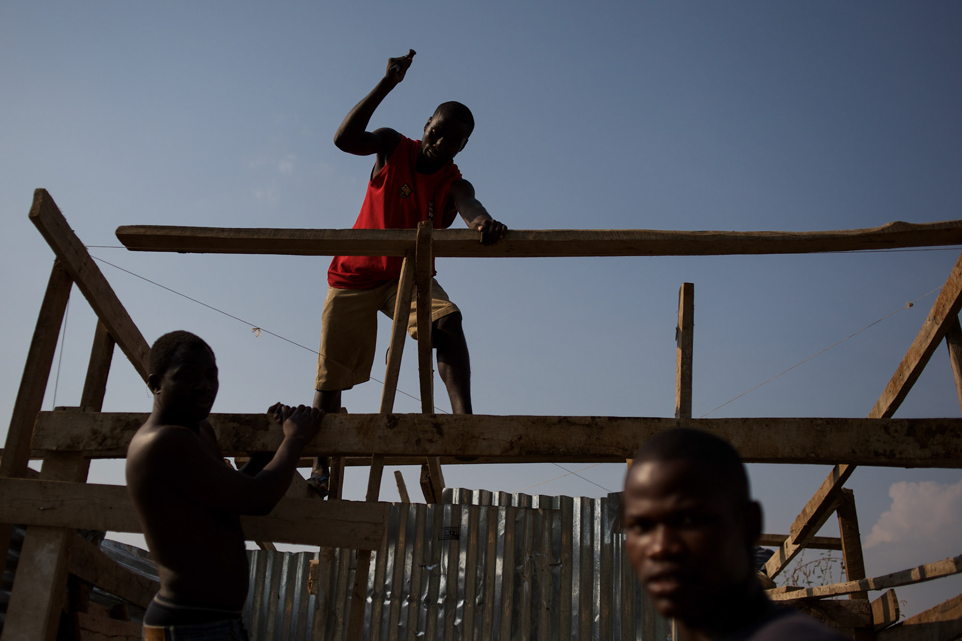 Burundian university students, seeking shelter outside the US embassy in Bujumbura, build toilets and showers in the yard of a vacant building close by. The students moved to the area in early May because, they claim, the US authorities ensure their security, after their university was closed amid anti-government protests. The government closed the university at the end of April, citing ìinsecurityî.