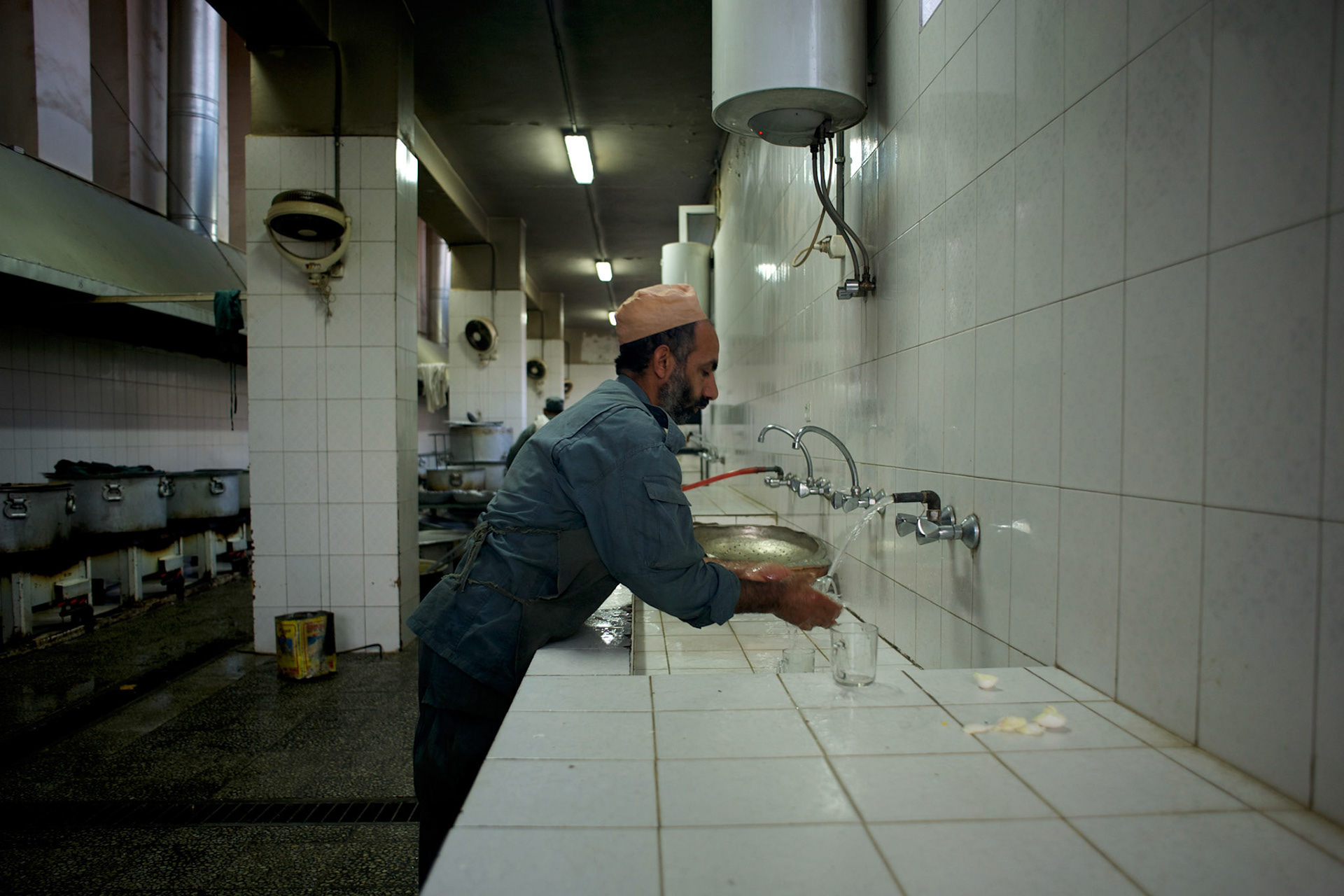 A chef prepares food at the kitchen of the Afghan Nacional Police Academy in Kabul.