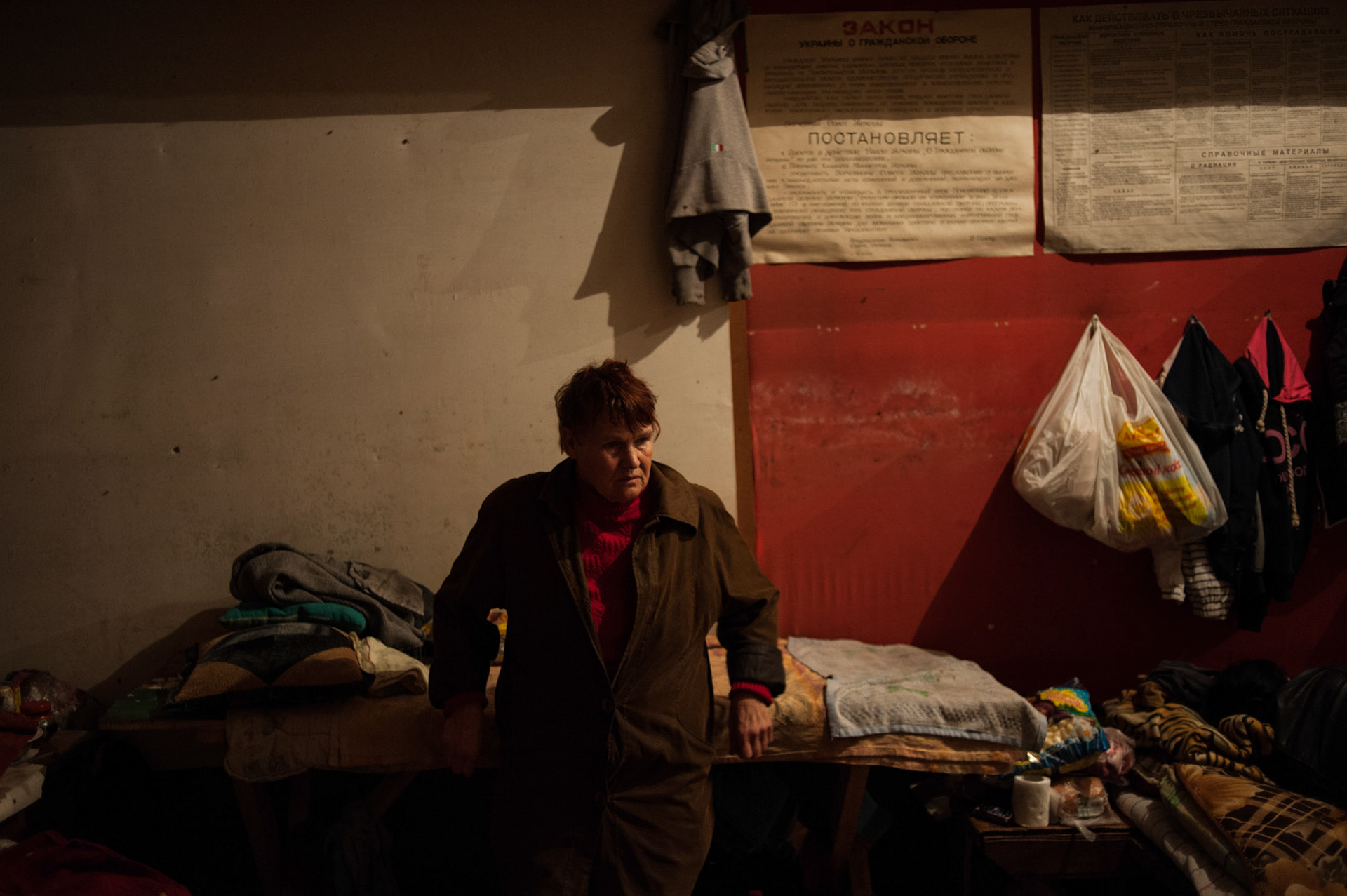 A local woman stands beside her belongings in a coal mine used as a bomb shelter outside Donetsk.
