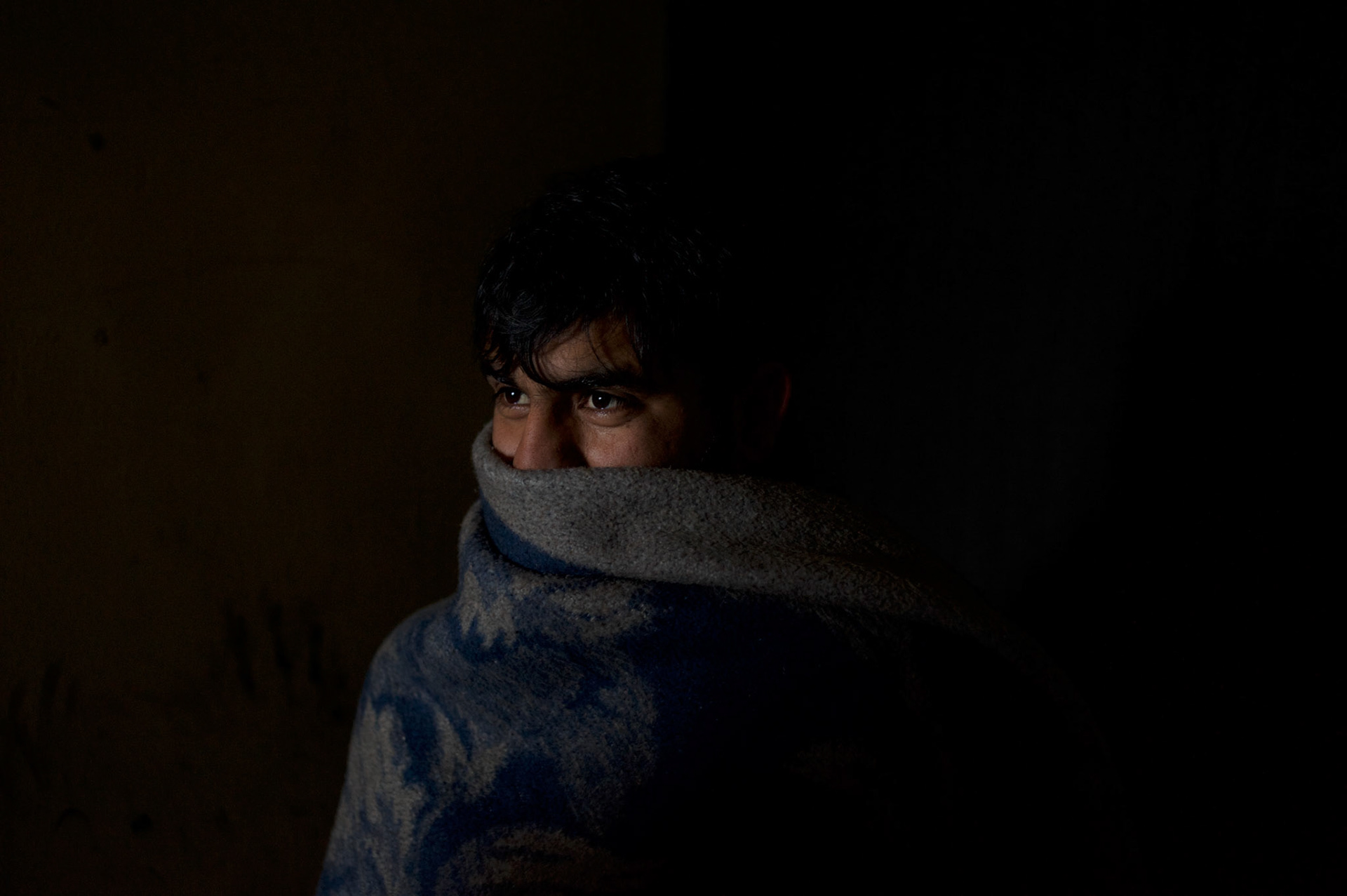 Abbas Khan, a 21 year old Pakistani migrant living for the past four months in a makeshift shelter near Belgrade's main railway and bus stations, in Serbia. As the majority of the migrants living here, Mr. Khan awaits the opportunity to cross the border with Hungary or Croatia so he can proceed his journey towards western Europe.