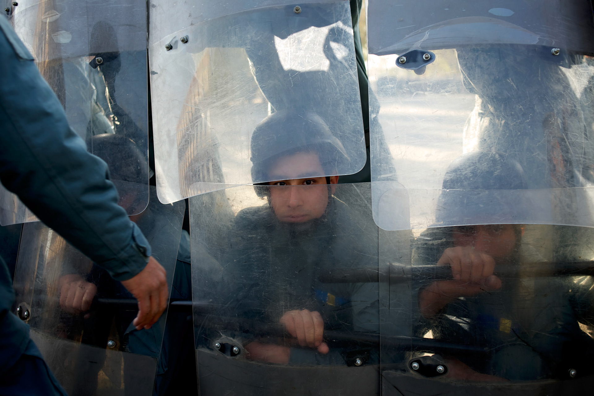 Afghan National Police (ANP) cadets train riot control during morning exercises at the Afghan Nacional Police Academy in Kabul. ANP Academy trains 1250 cadets at the time during a period of four years. Every year, five hundred new recruits are selected, out of more than nine thousand of candidates, to join the academy and other five hundred graduate. Fifteen per cent of the recruits are women.